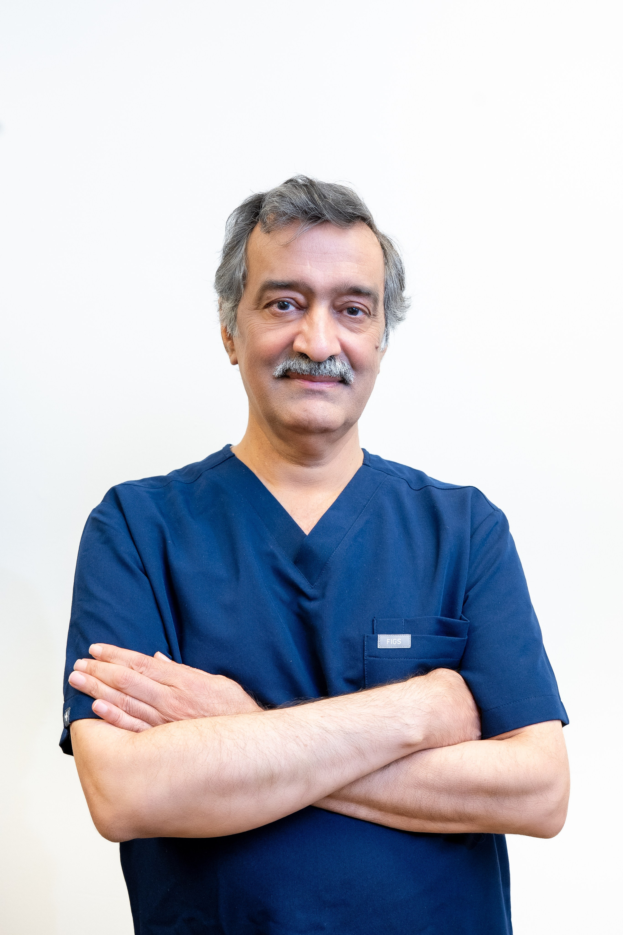 Medical team standing confidently in blue uniforms