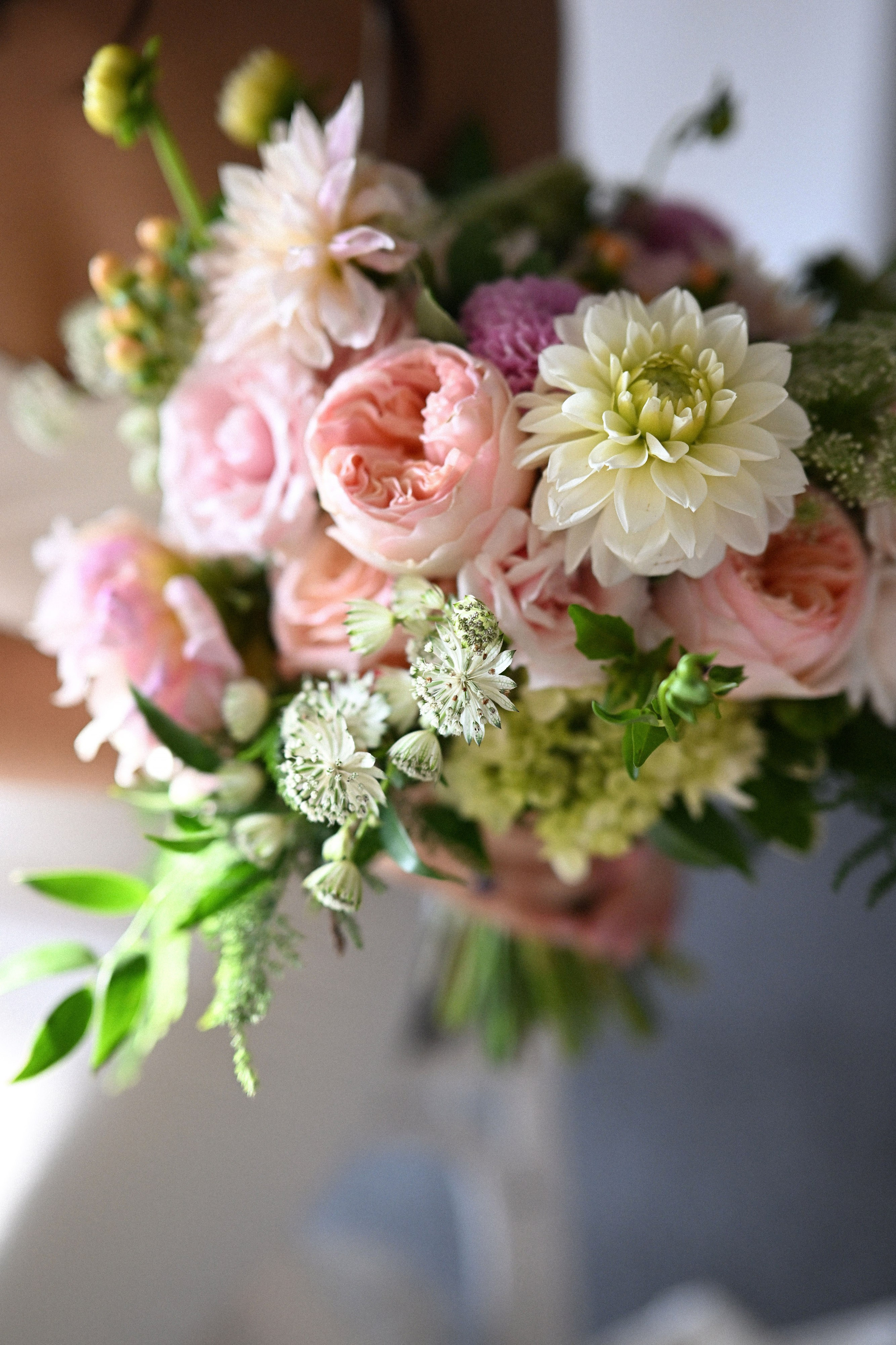 a bride holding a bouquet of flowers