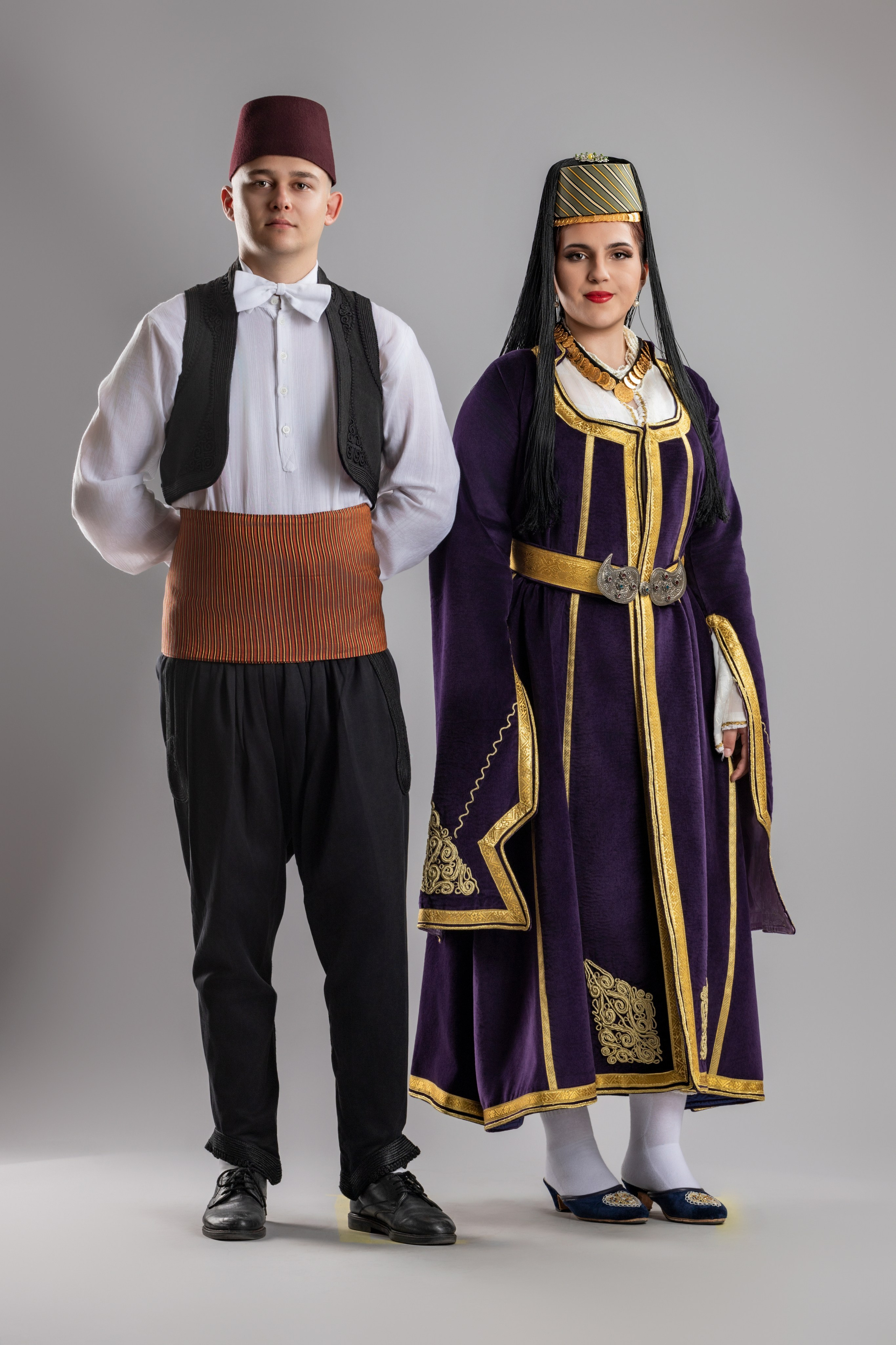 Studio portrait photography of traditional folk costumes from Bosnia and Herzegovina featuring authentic cultural clothing, embroidery, jewelry and handcrafted garments, photographed by Namir Čomaga. The images highlight the richness, craftsmanship and cultural heritage of Bosnian traditional costumes through carefully lit studio portraits.