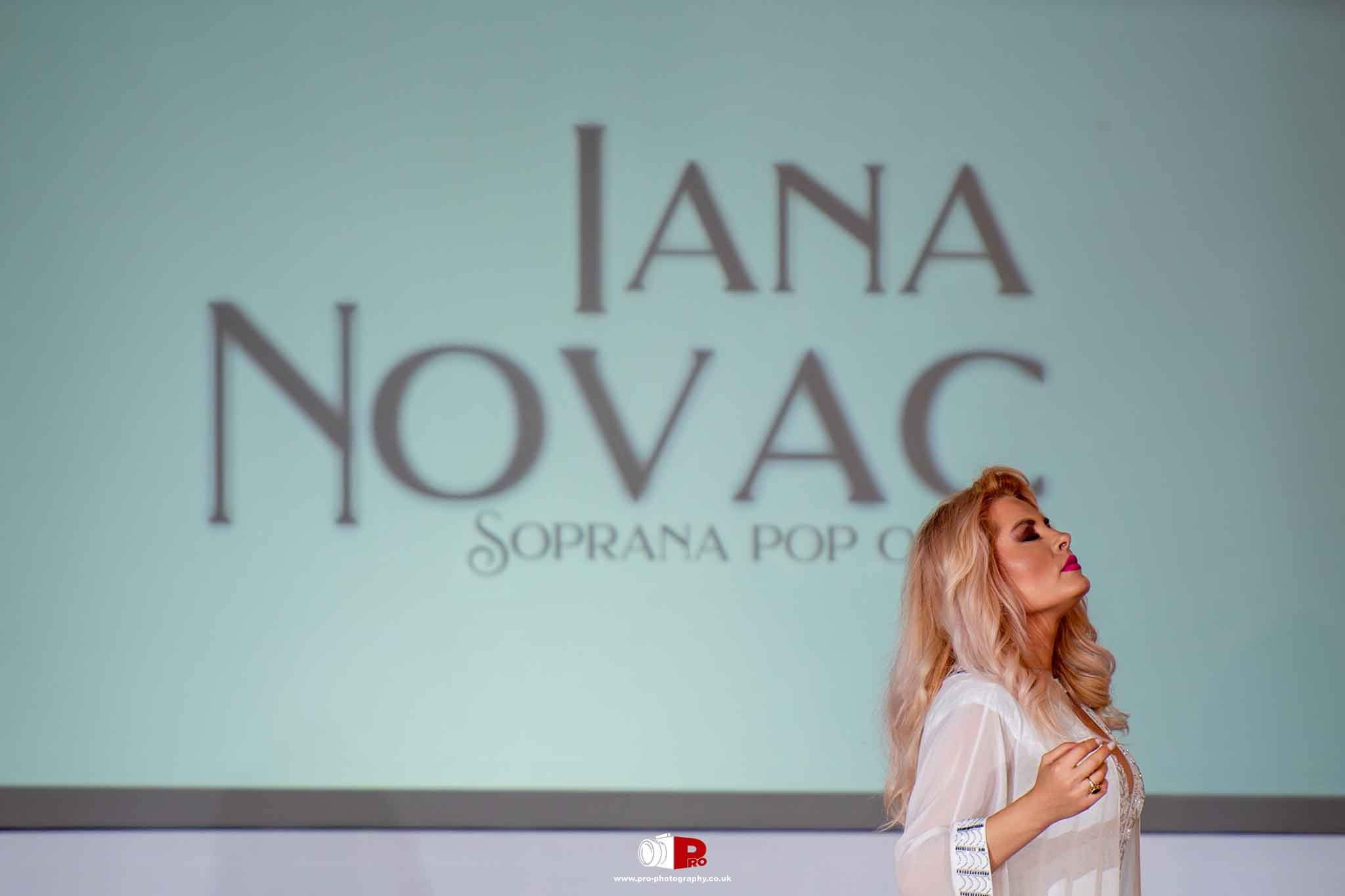 Iana Novac delivers a captivating live performance on stage at a gala event.