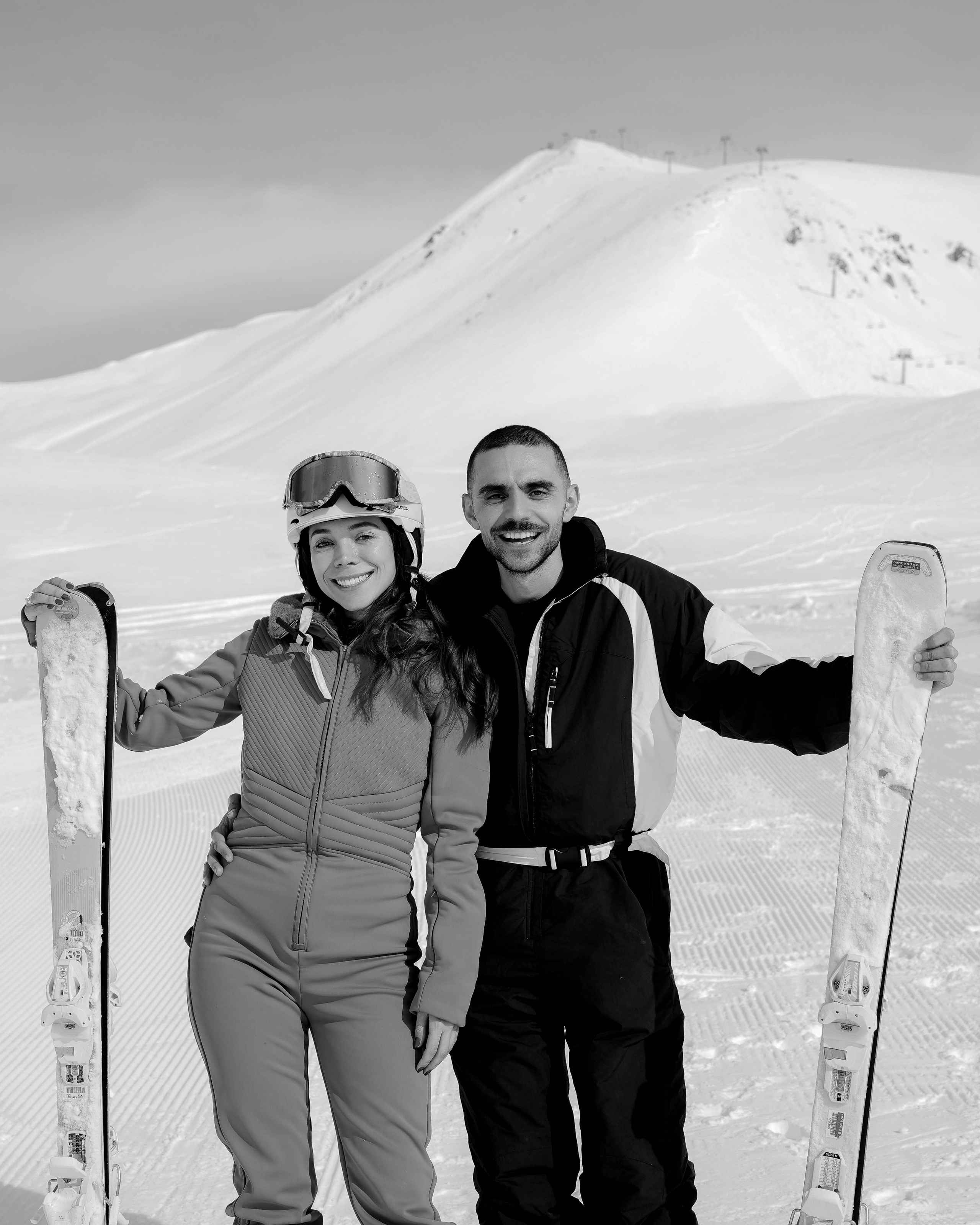 Couple posing with skis in Gudauri resort