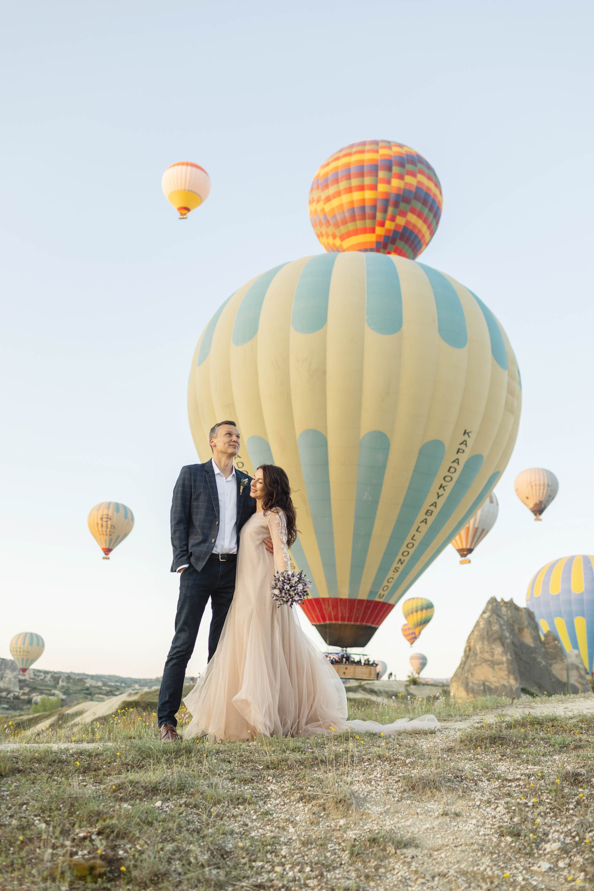 Magical Wedding Photoshoot in Cappadocia: Balloons, Caves, and Valleys. Julia Ganch I Fashion Wedding Photography I Cappadocia Turkey