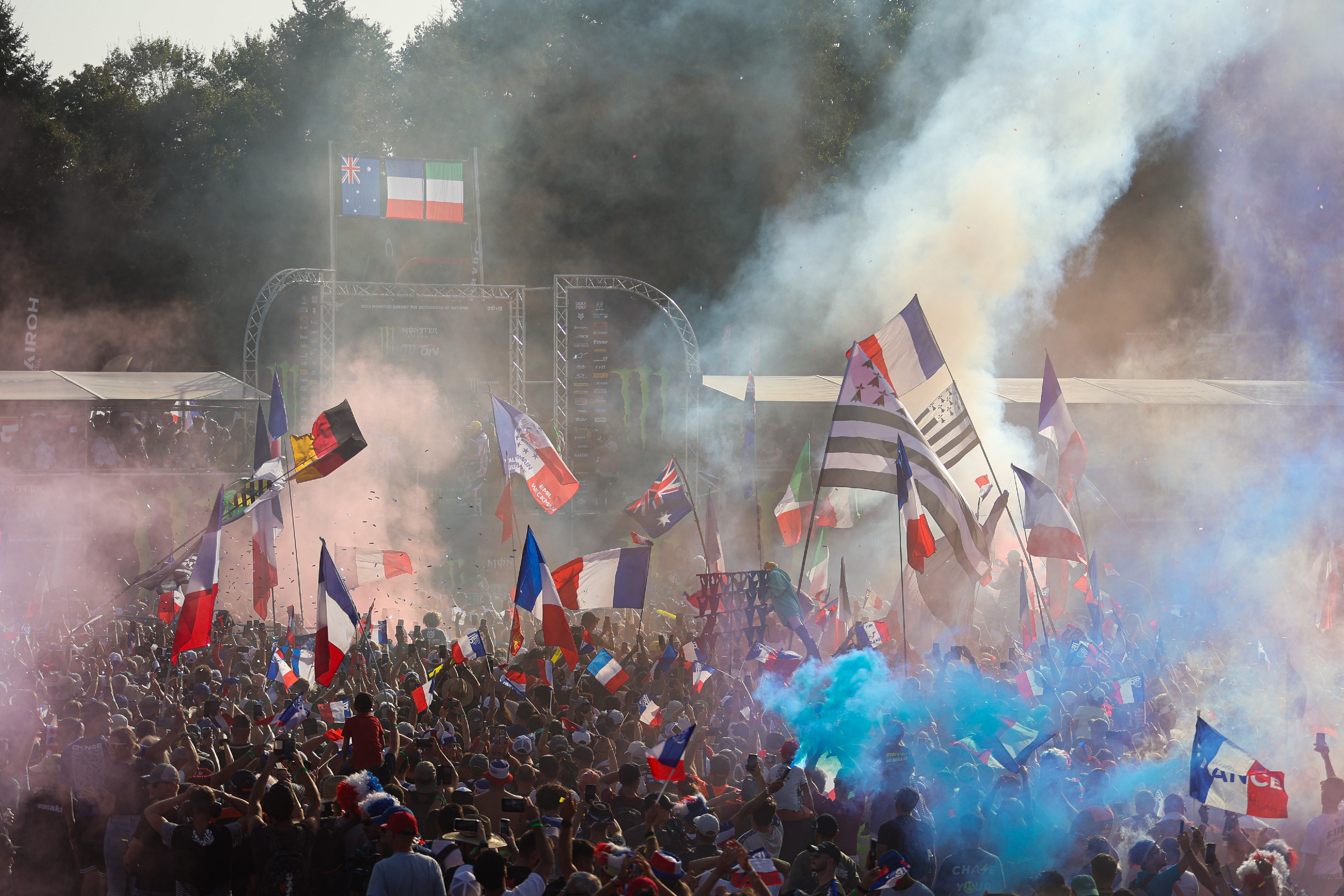MXoN podium Ernée 2023 with french flags and smoke bombs