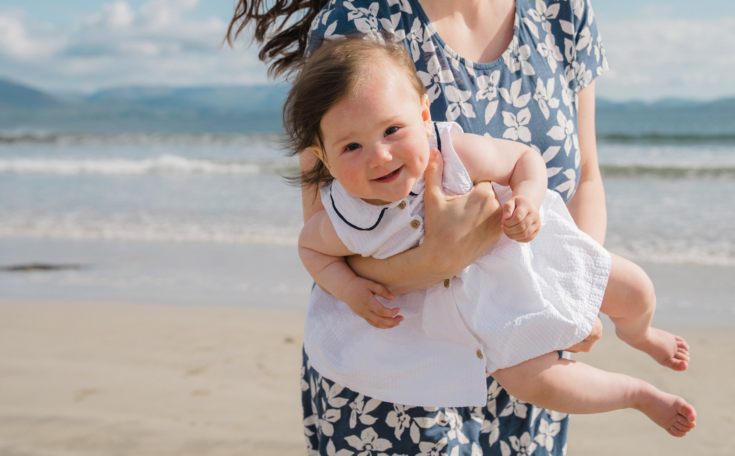 Darya and Mia at the ocean. Wedding and family photographer Ireland
