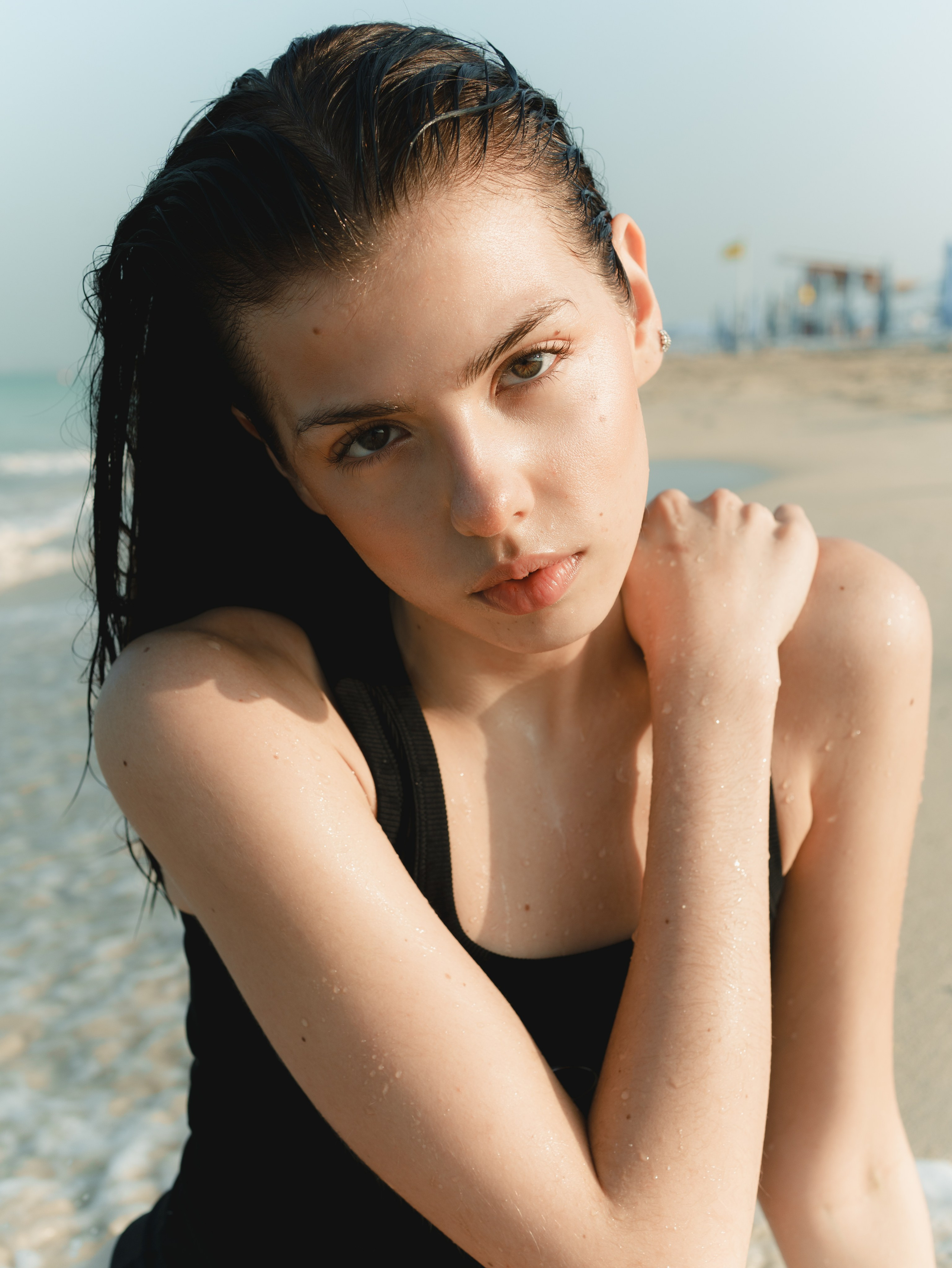 Fashion portrait series on the beach in minimalistic swimwear look. Alisha Geva | Contemporary fashion women’s portrait Dubai
