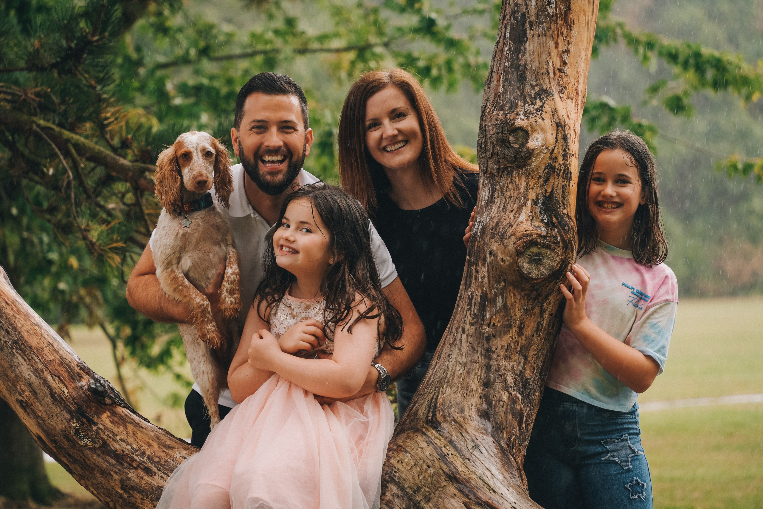 Family portrait outdoors with parents and children, natural family photography in Solihull