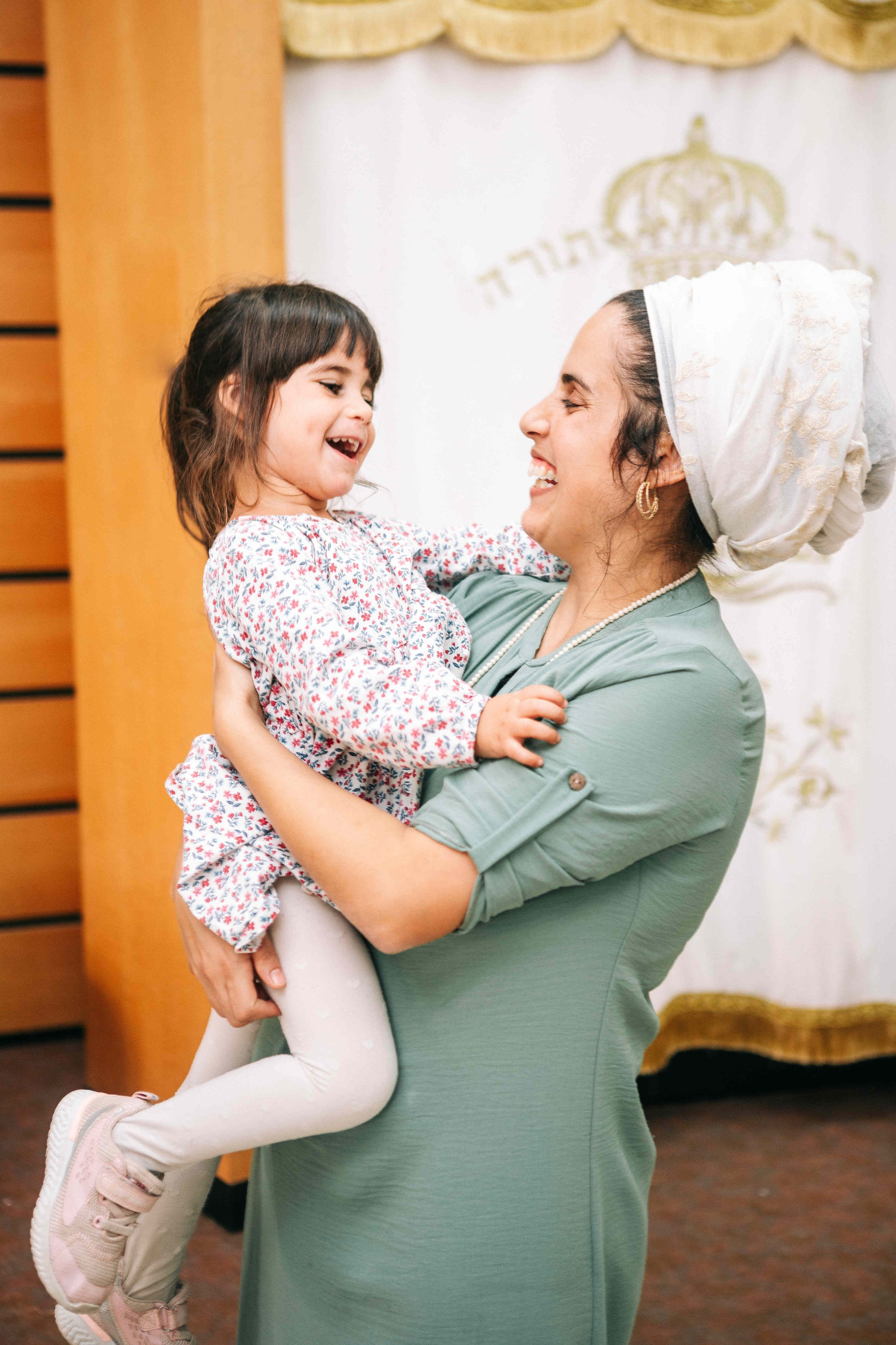 BRITH MILA IN THE SMALL SYNAGOGUE. PHOTOGRAPHER IN ISRAEL