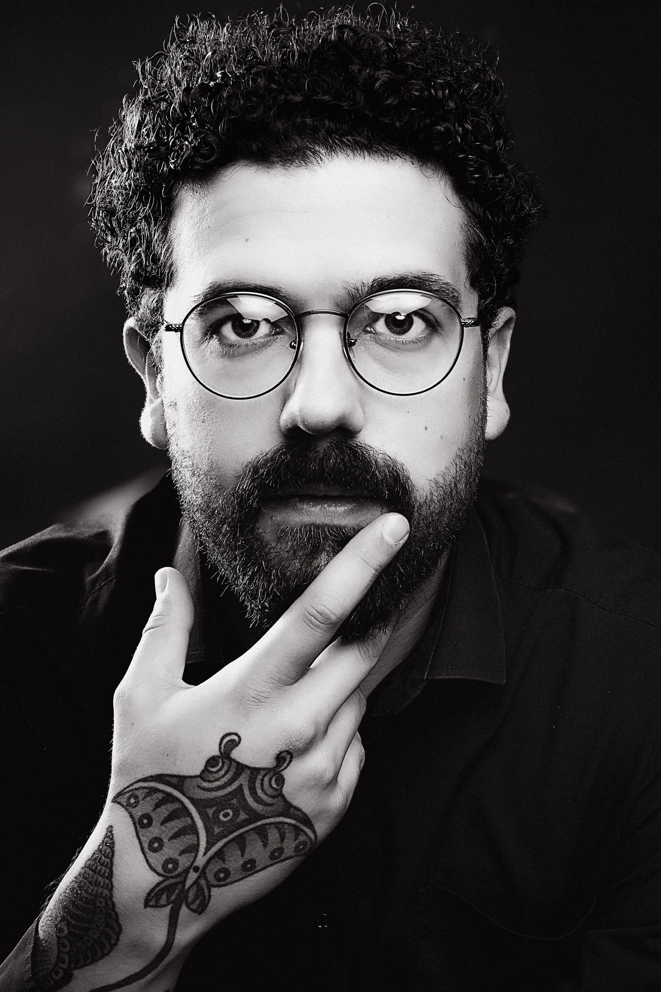 Dramatic black and white portrait of a man with beard, cinematic studio photography Baltic region - Tallinn, Riga and Vilnius. 