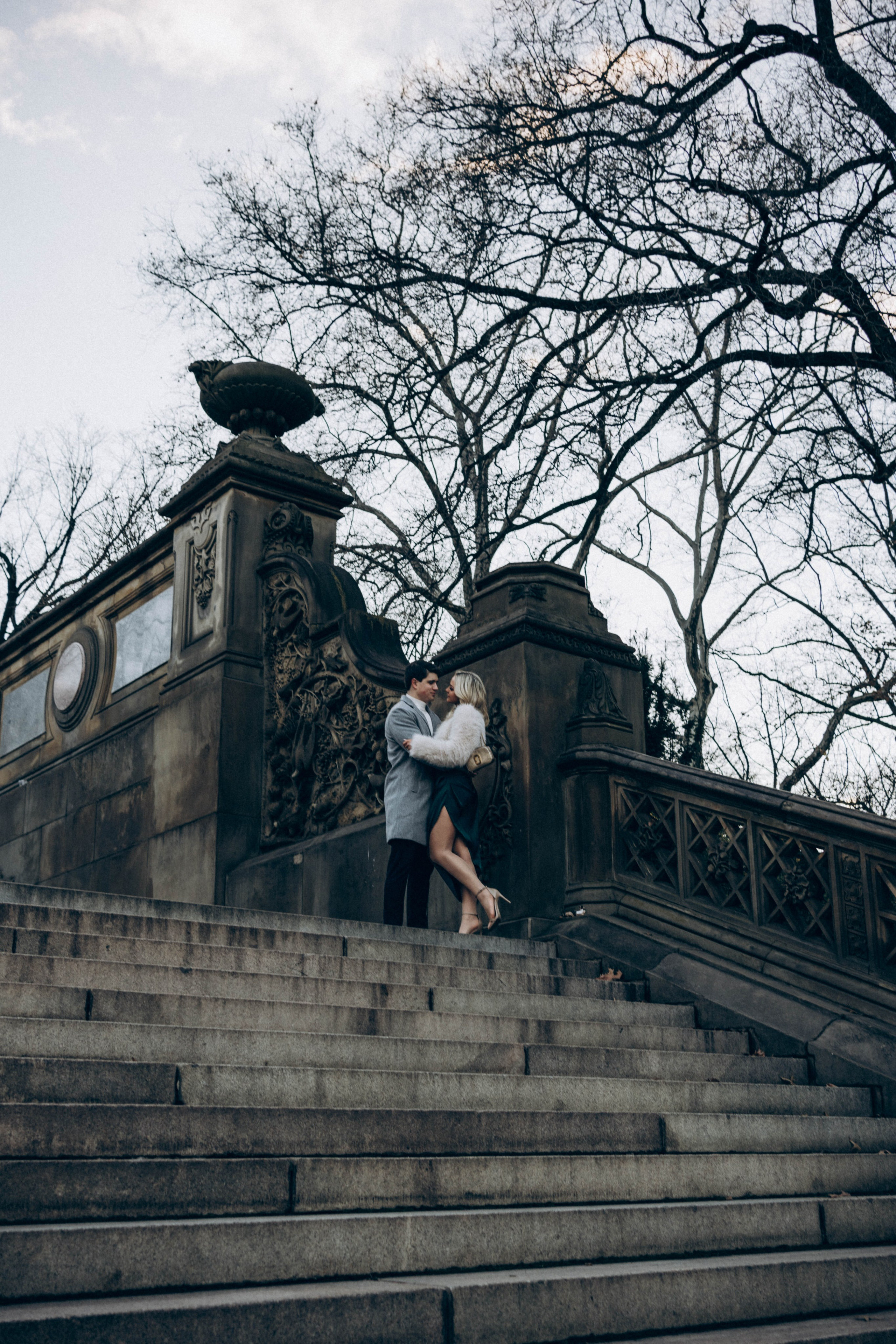 Man proposing under arch in Central Park.