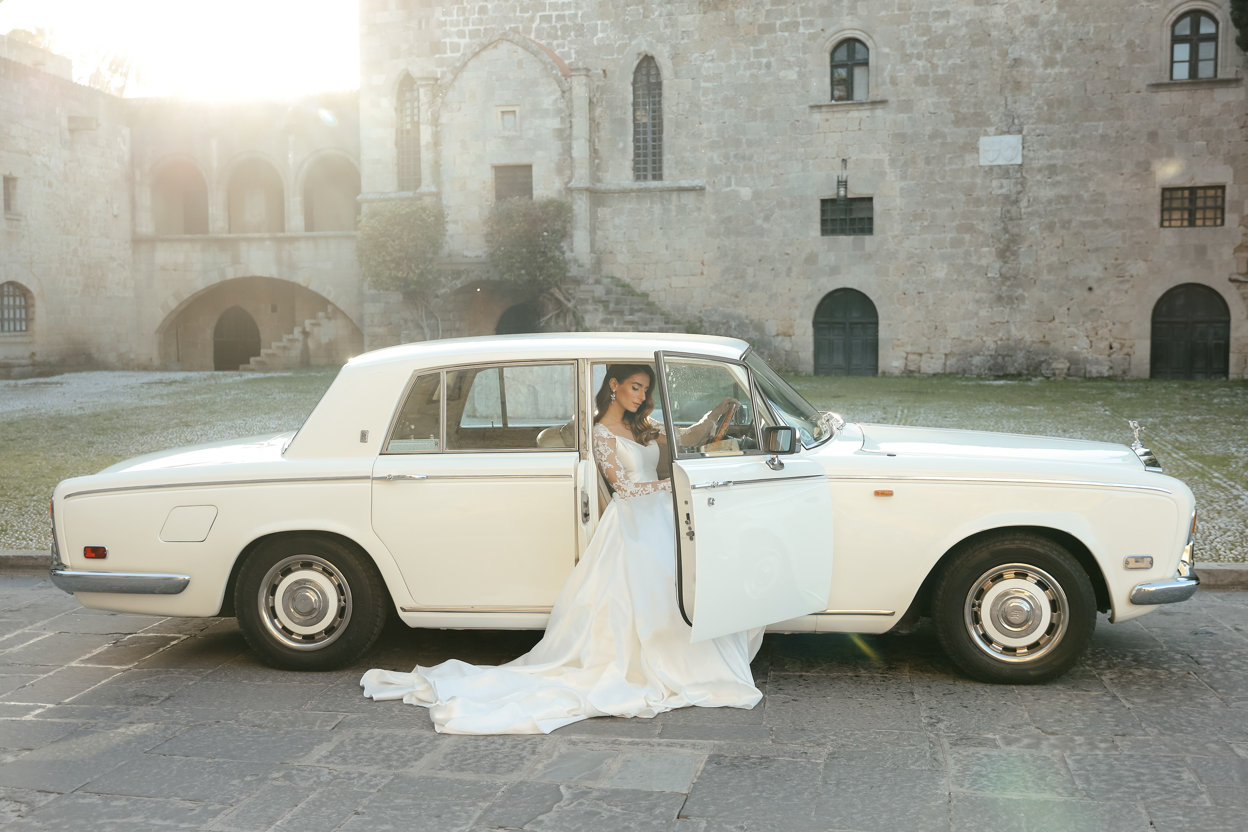A bride in Rolls Royce in old town of Rhodes island, Greece