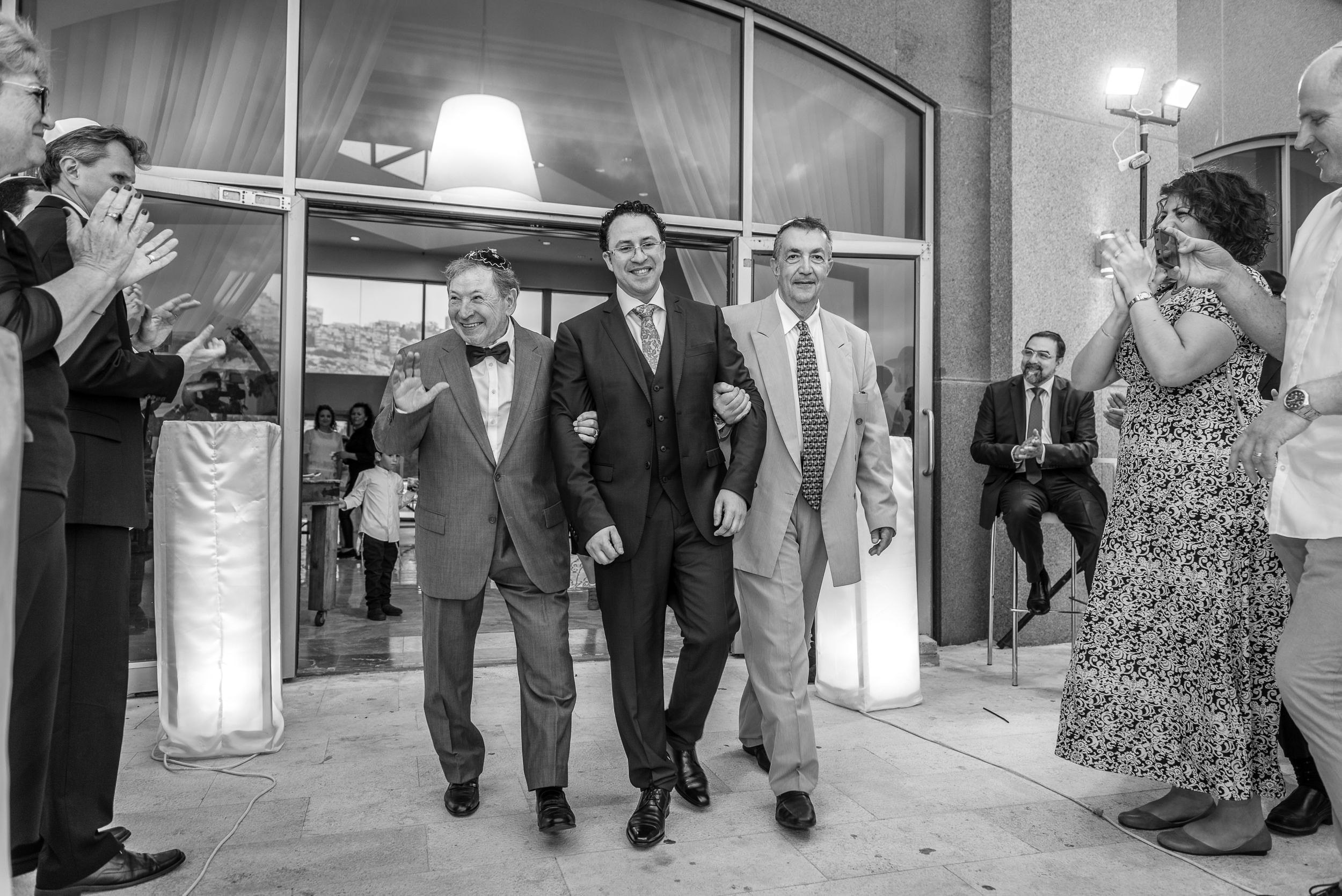 Groom Michael walking down the aisle during his wedding ceremony at the Leonardo Hotel in Haifa, Israel