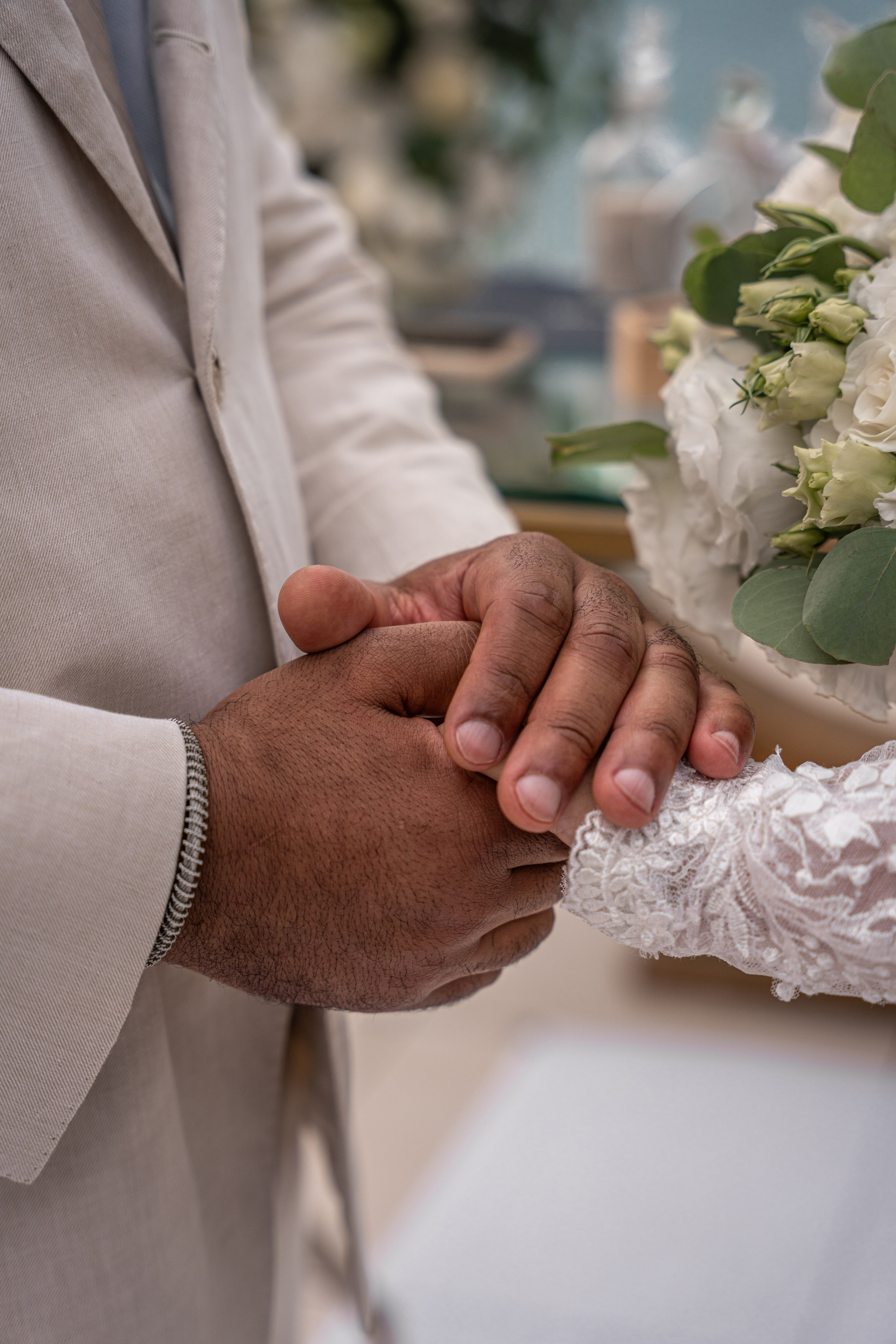 Couple holding hands during wedding ceremony in Playa del Carmen