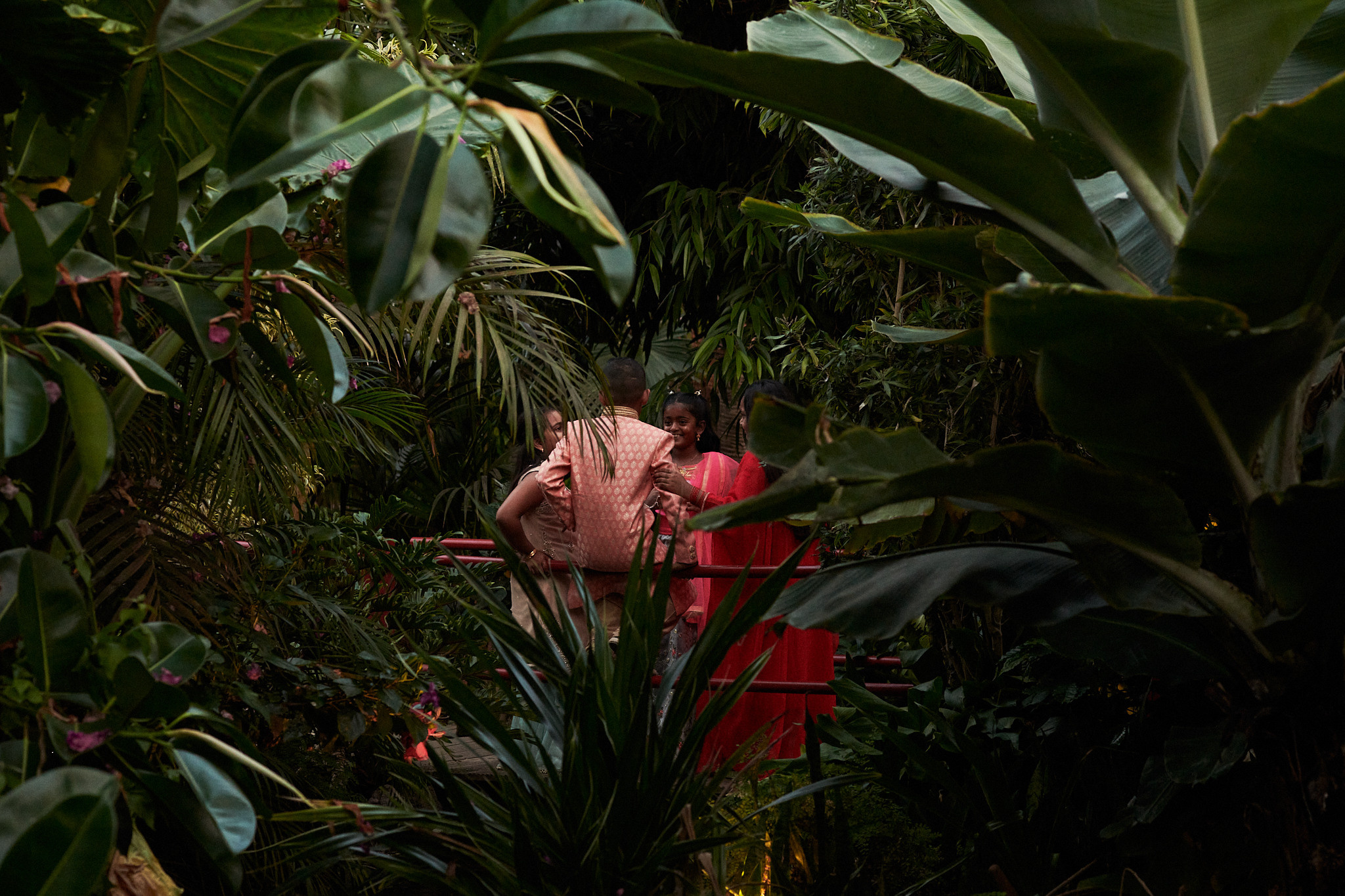 Indian wedding. The bride and her friend fixing her dress before the ceremony.