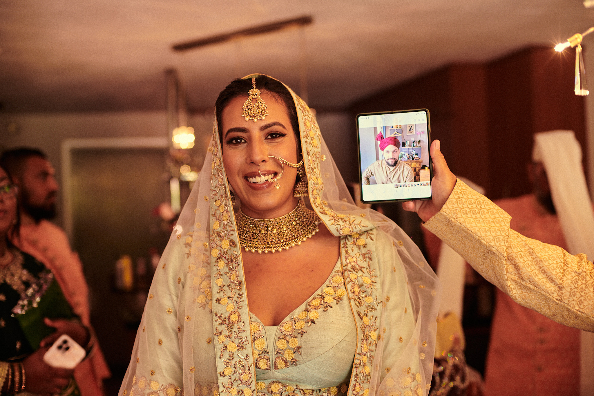 Bride in traditional red sari with gold jewelry during Hindu wedding in Amsterdam