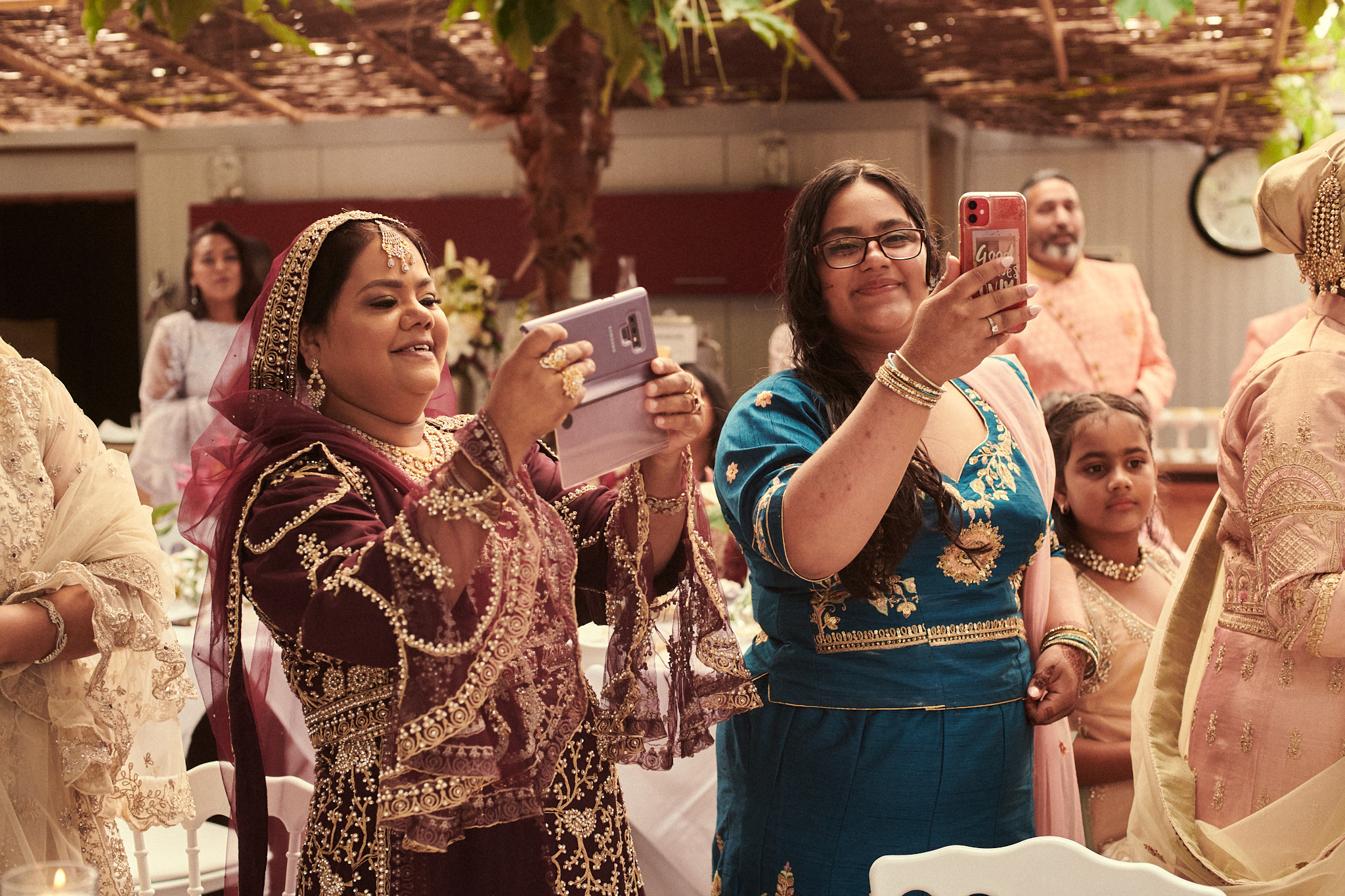 Guests in colorful attire celebrating Hindu wedding festivities in the Netherlands