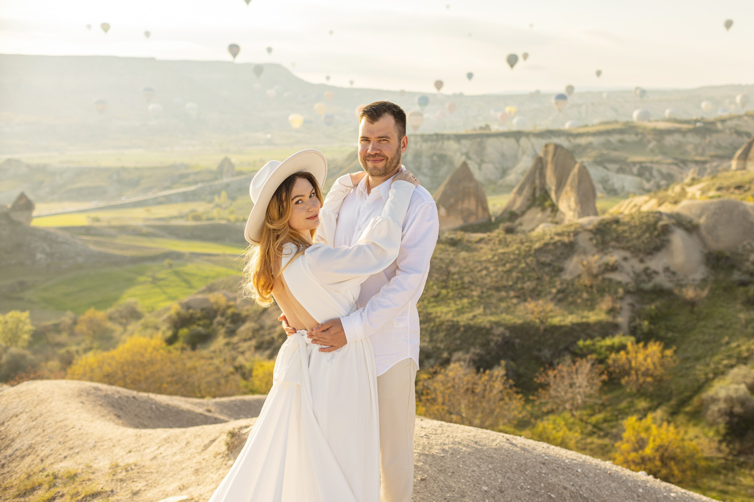 Elegant Wedding Photoshoot with a Flowing Dress and Balloons in Cappadocia. Julia Ganch I Fashion Wedding Photography I Cappadocia Turkey