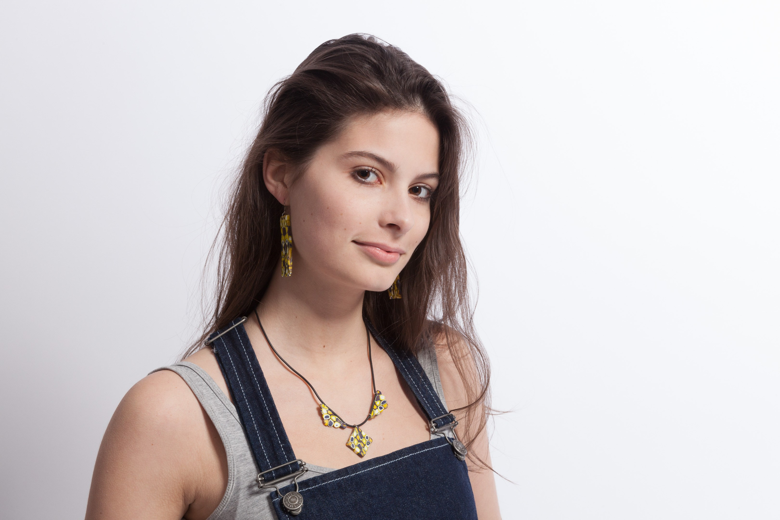 Portrait of a young girl on white studio background - photographer Andrey Dunin