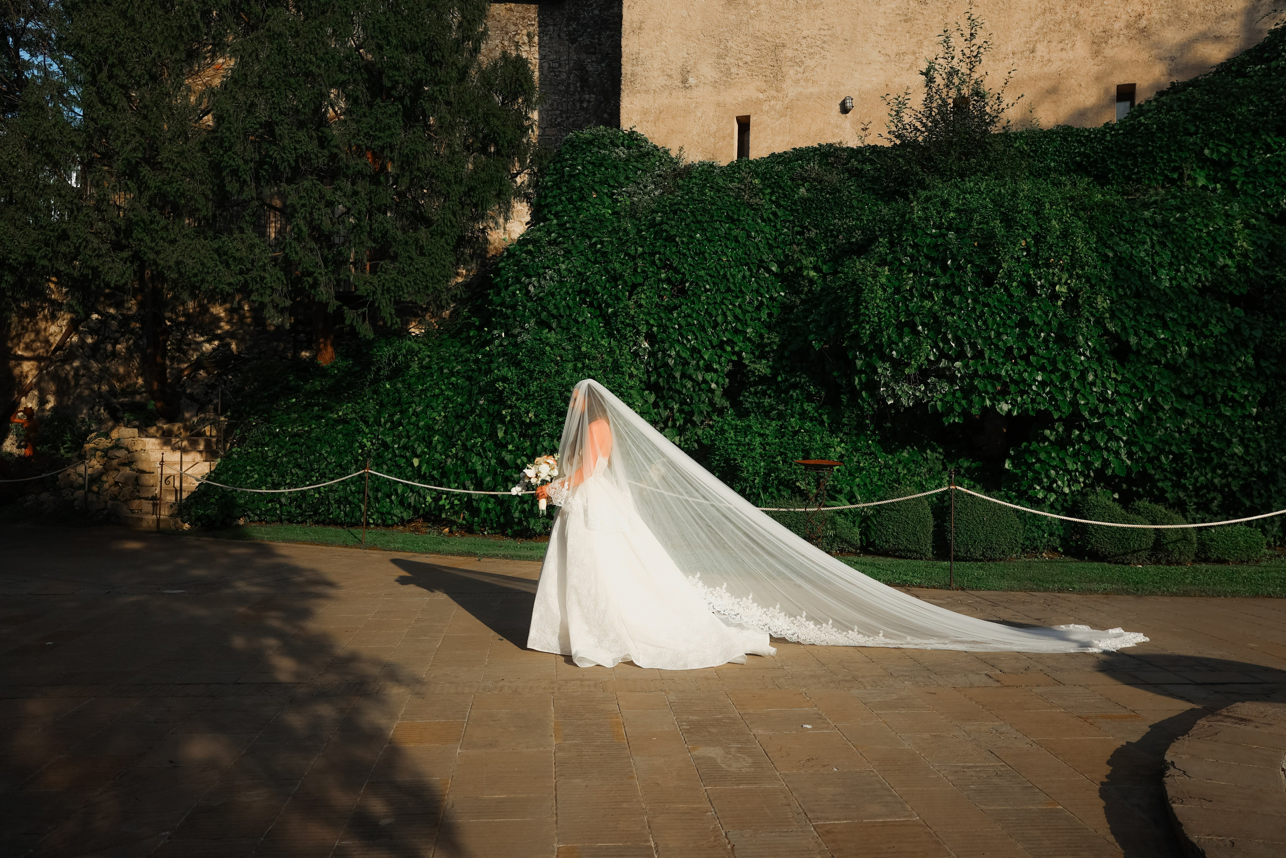 Bride walking down the aisle in a softly lit church.