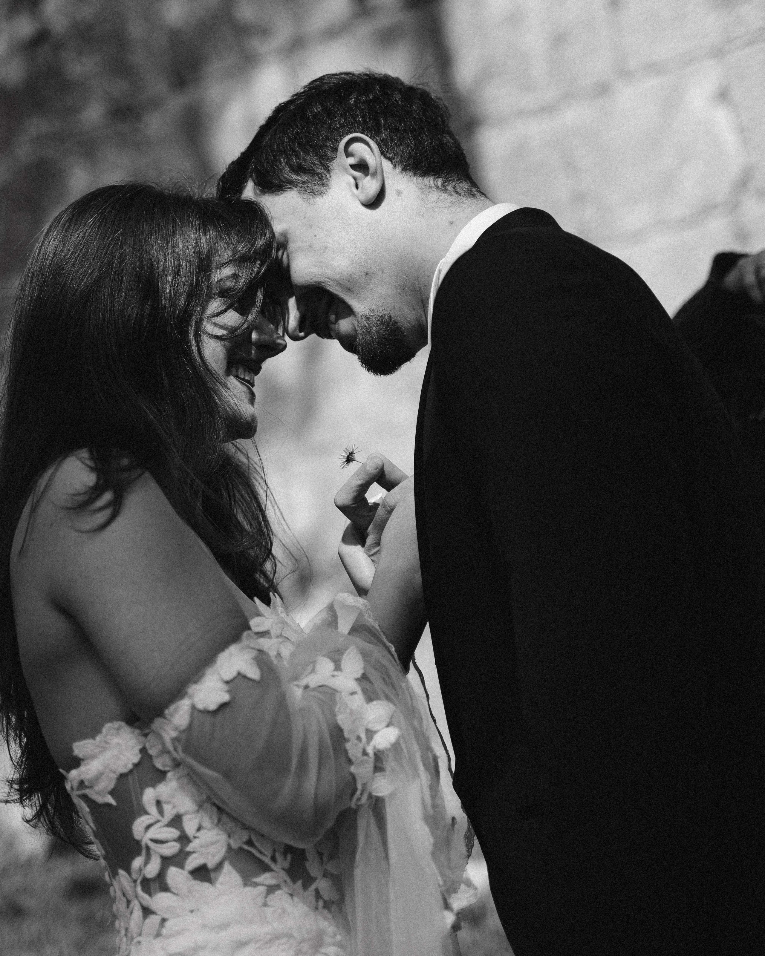 Bride and groom laughing with faces close together