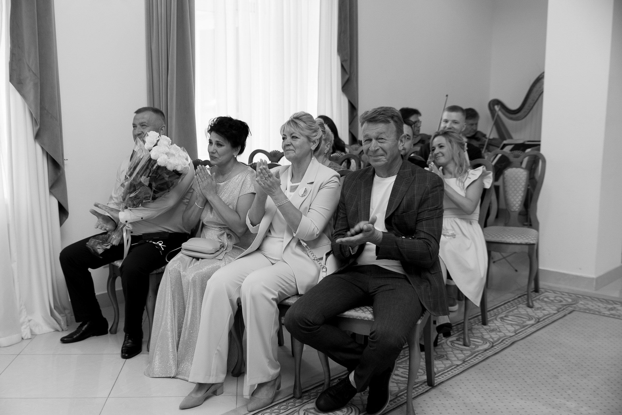 Couple’s first kiss indoors, by Bude, Cornwall reportage photographer.