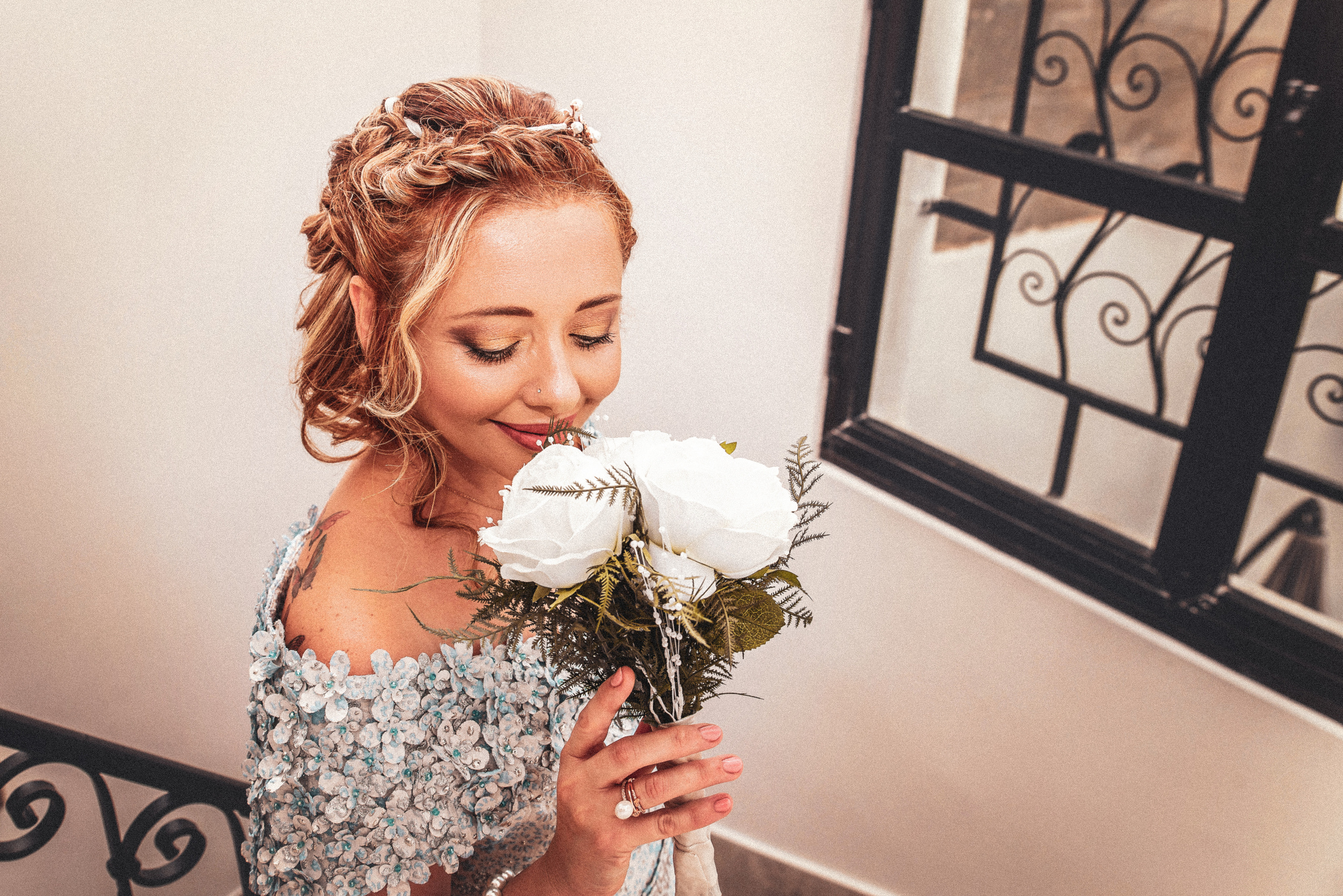 bride sniffing flowers