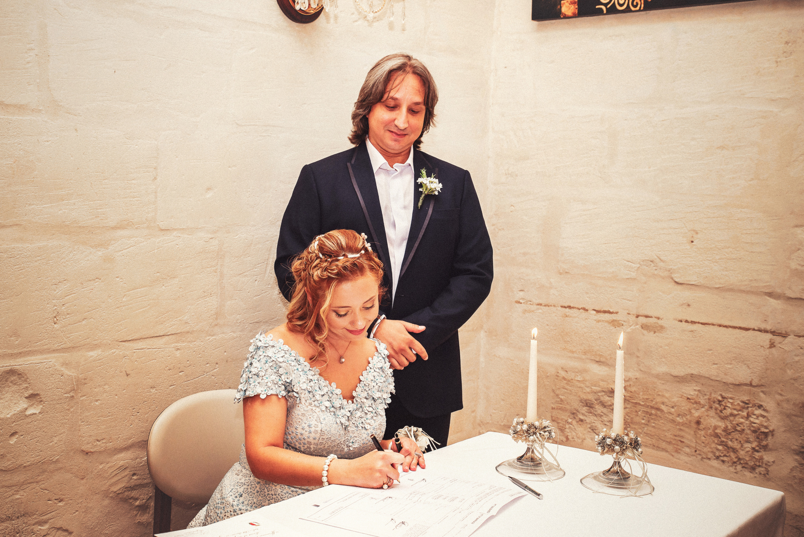 the bride signs on the document