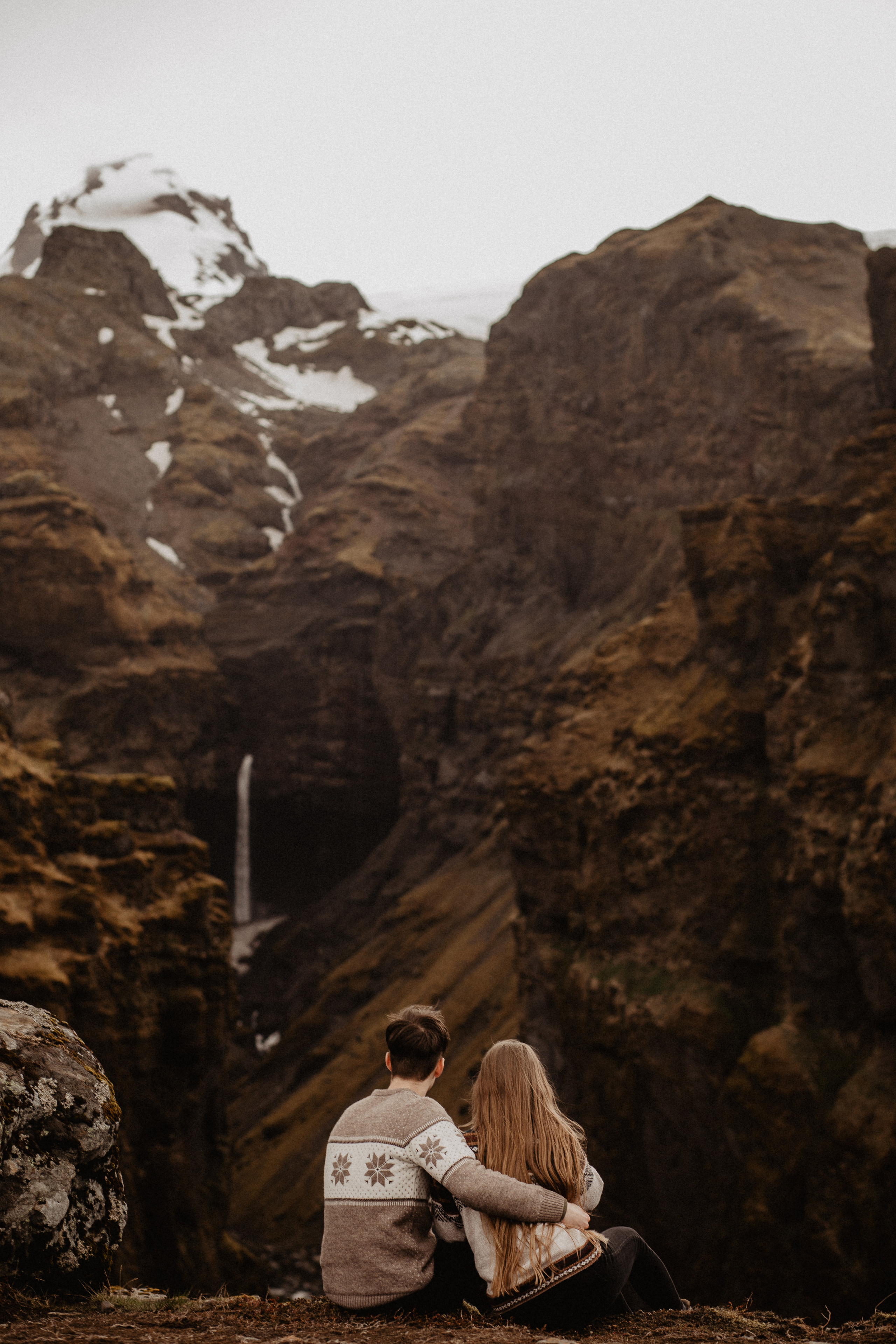 Couple photoshoot in front of volcano eruption in Iceland. Iceland elopement photographer & videographer