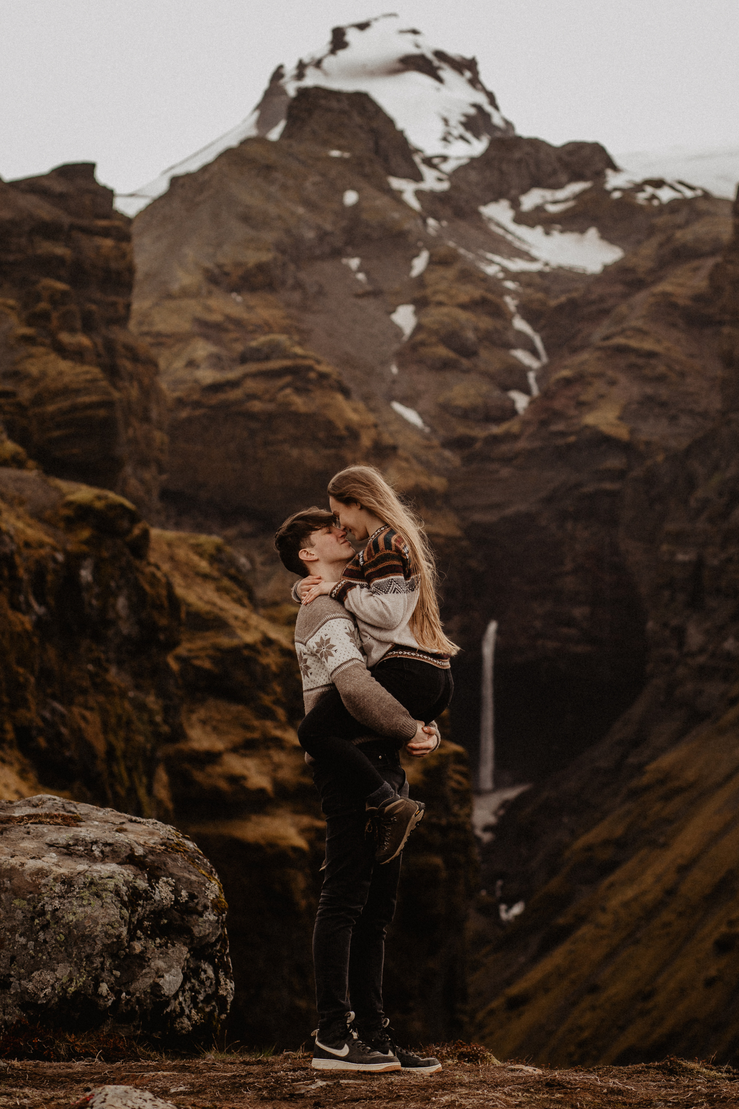 Couple photoshoot in front of volcano eruption in Iceland. Iceland elopement photographer & videographer