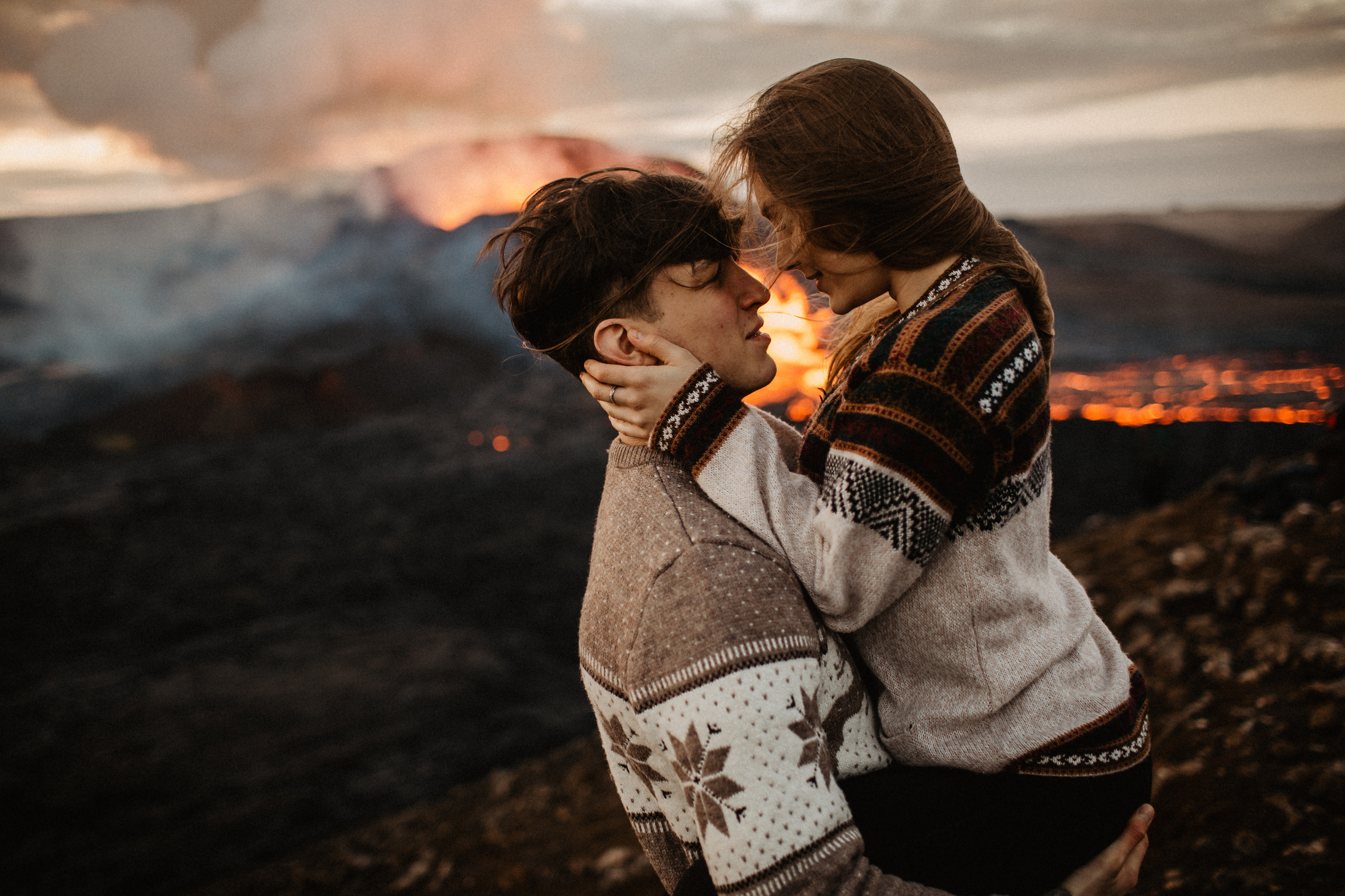 Couple photoshoot in front of volcano eruption in Iceland. Iceland elopement photographer & videographer