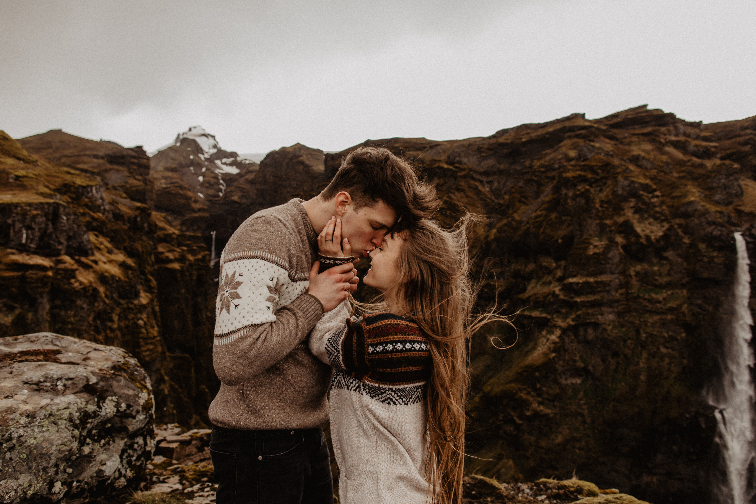 Couple photoshoot in front of volcano eruption in Iceland. Iceland elopement photographer & videographer
