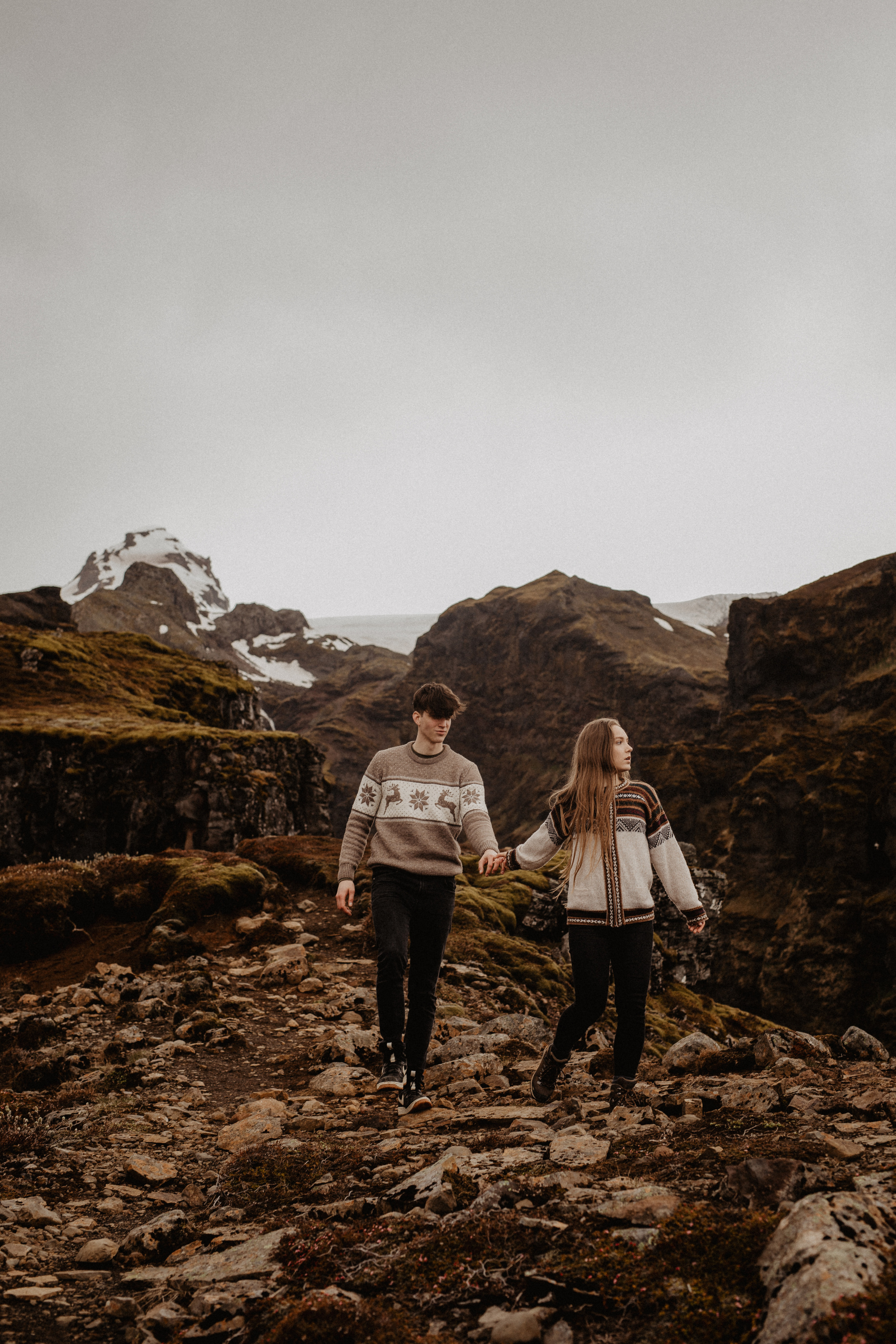 Couple photoshoot in front of volcano eruption in Iceland. Iceland elopement photographer & videographer