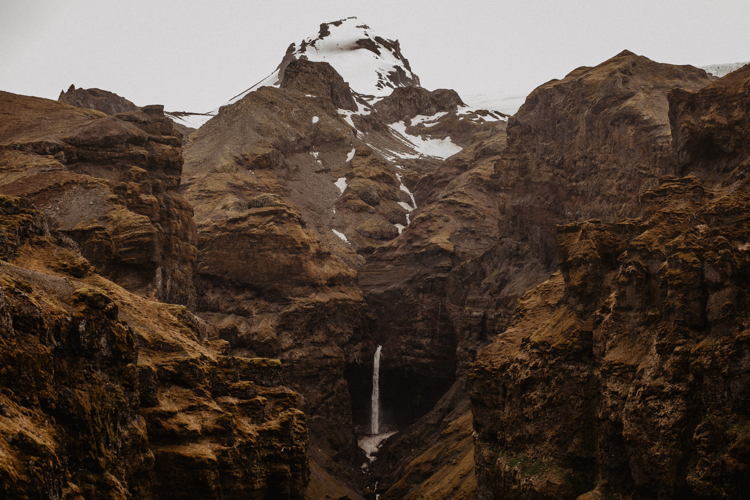 Couple photoshoot in front of volcano eruption in Iceland. Iceland elopement photographer & videographer