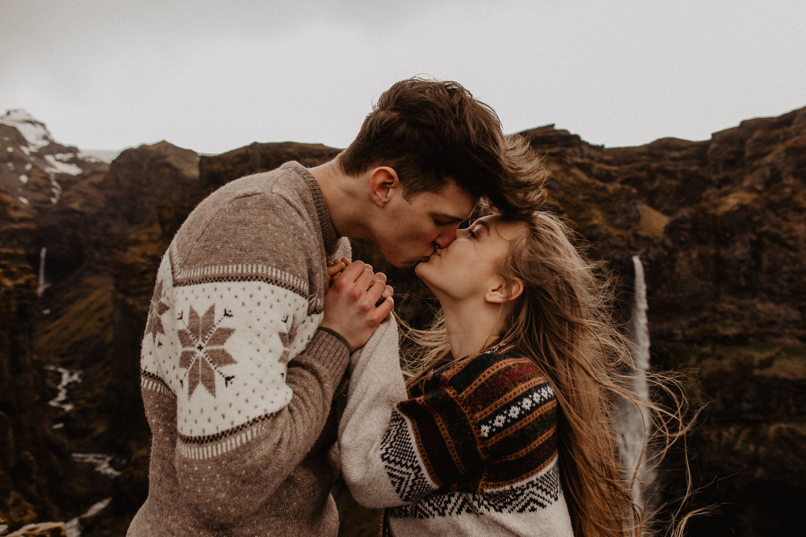 Couple photoshoot in front of volcano eruption in Iceland. Iceland elopement photographer & videographer