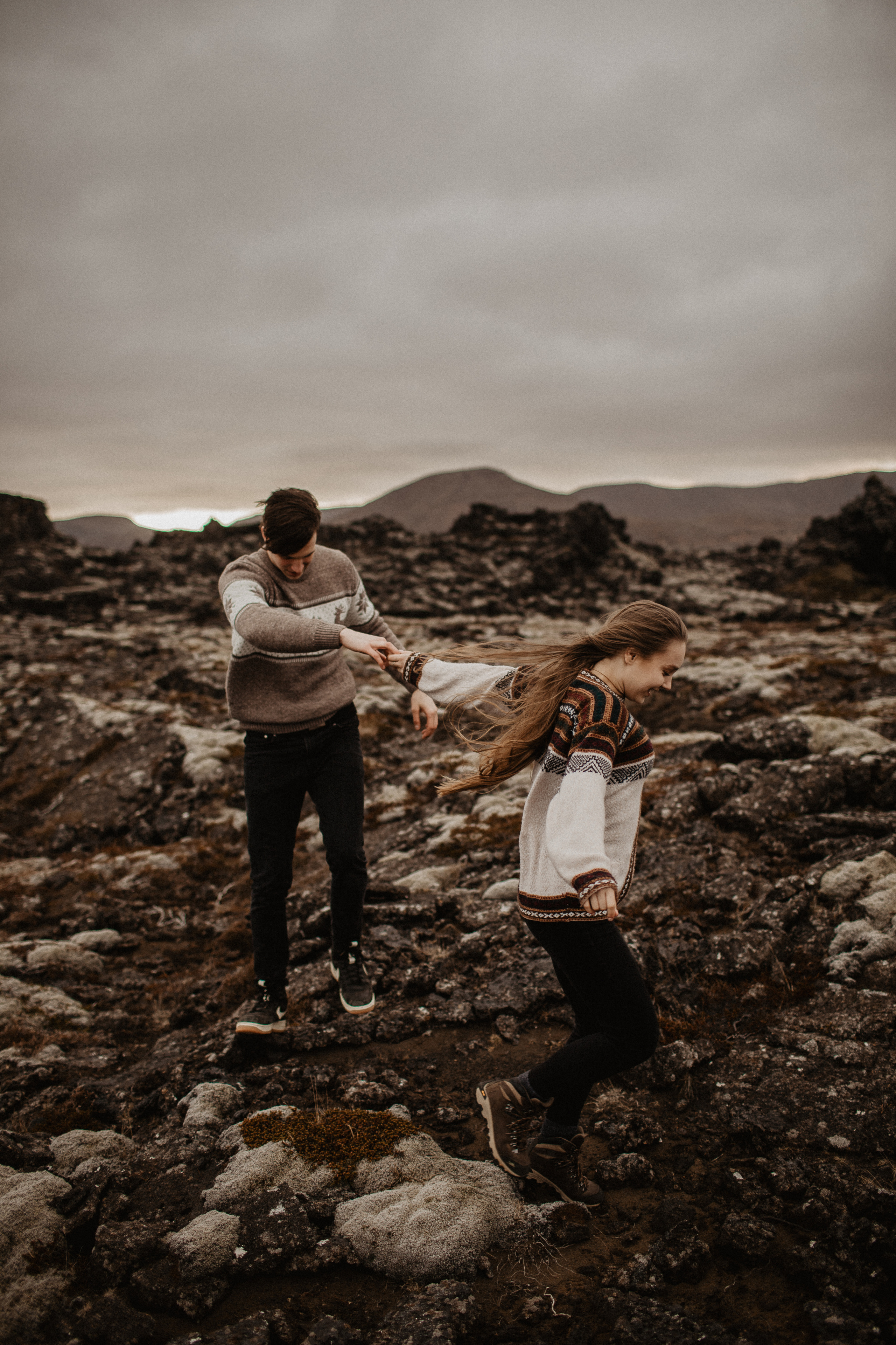 Couple photoshoot in front of volcano eruption in Iceland. Iceland elopement photographer & videographer