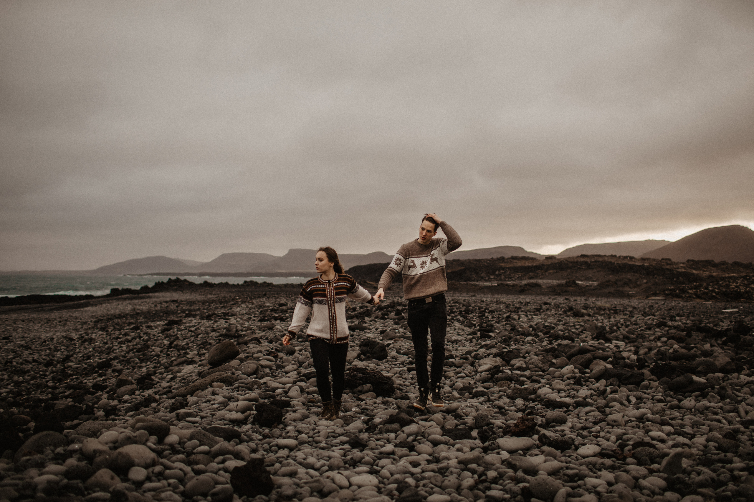Couple photoshoot in front of volcano eruption in Iceland. Iceland elopement photographer & videographer