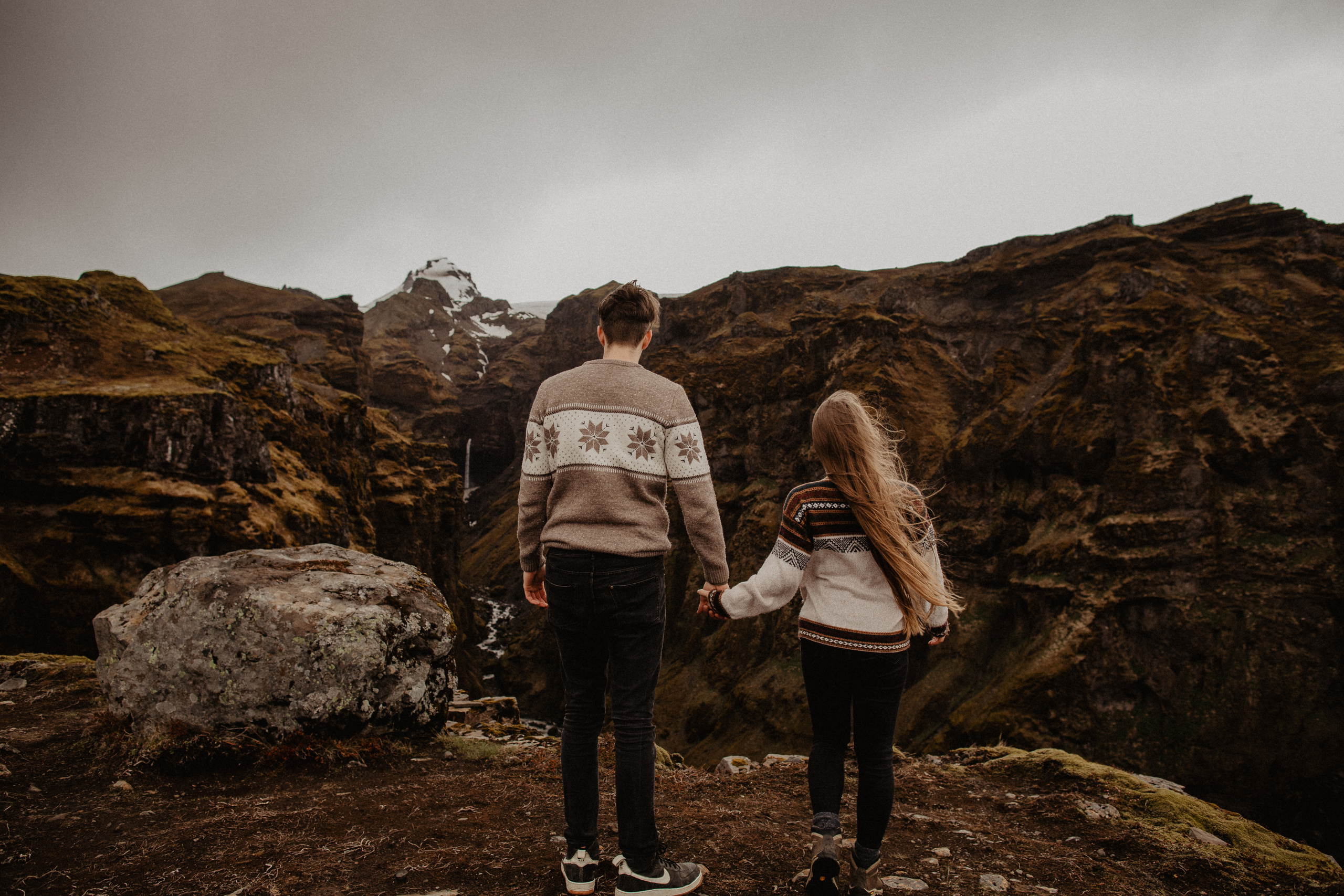 Couple photoshoot in front of volcano eruption in Iceland. Iceland elopement photographer & videographer