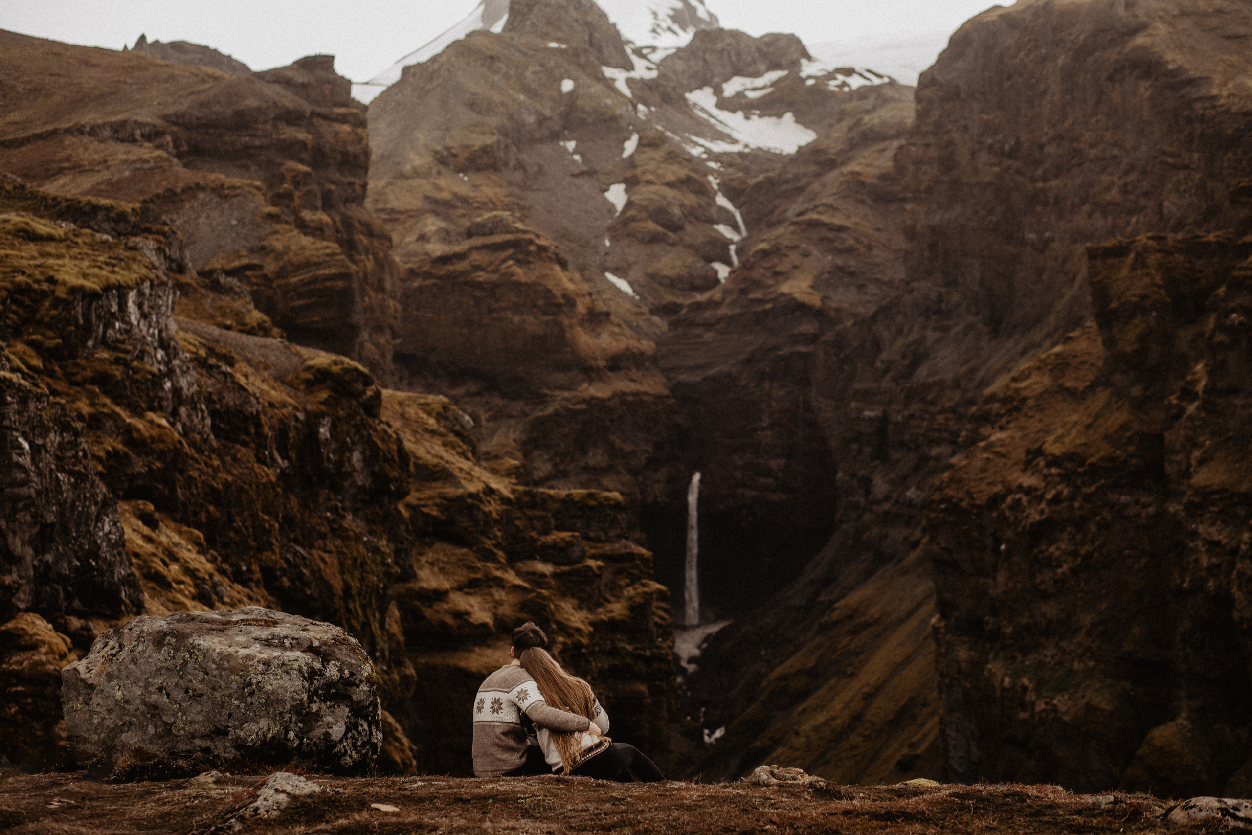 Couple photoshoot in front of volcano eruption in Iceland. Iceland elopement photographer & videographer
