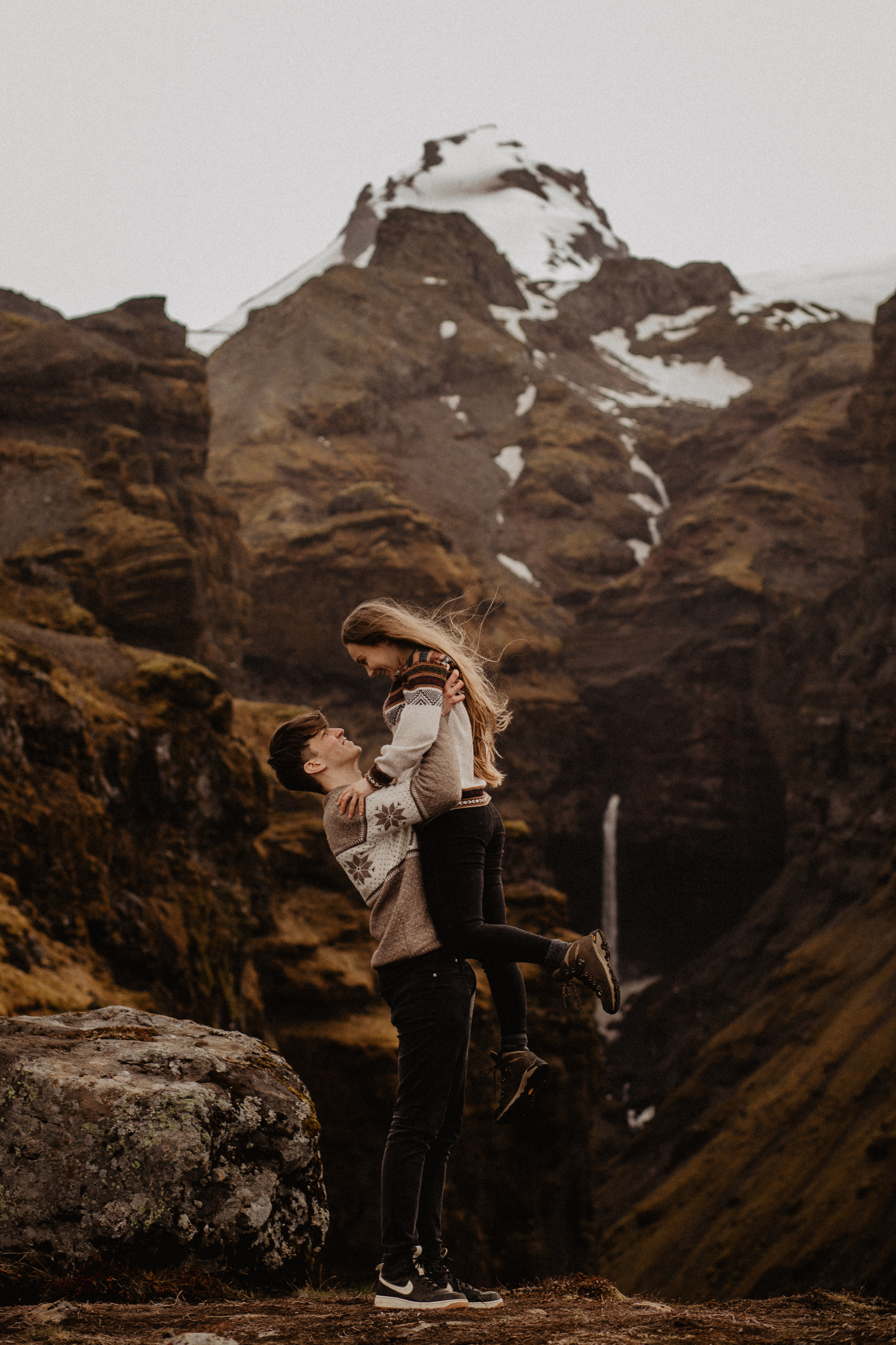 Couple photoshoot in front of volcano eruption in Iceland. Iceland elopement photographer & videographer