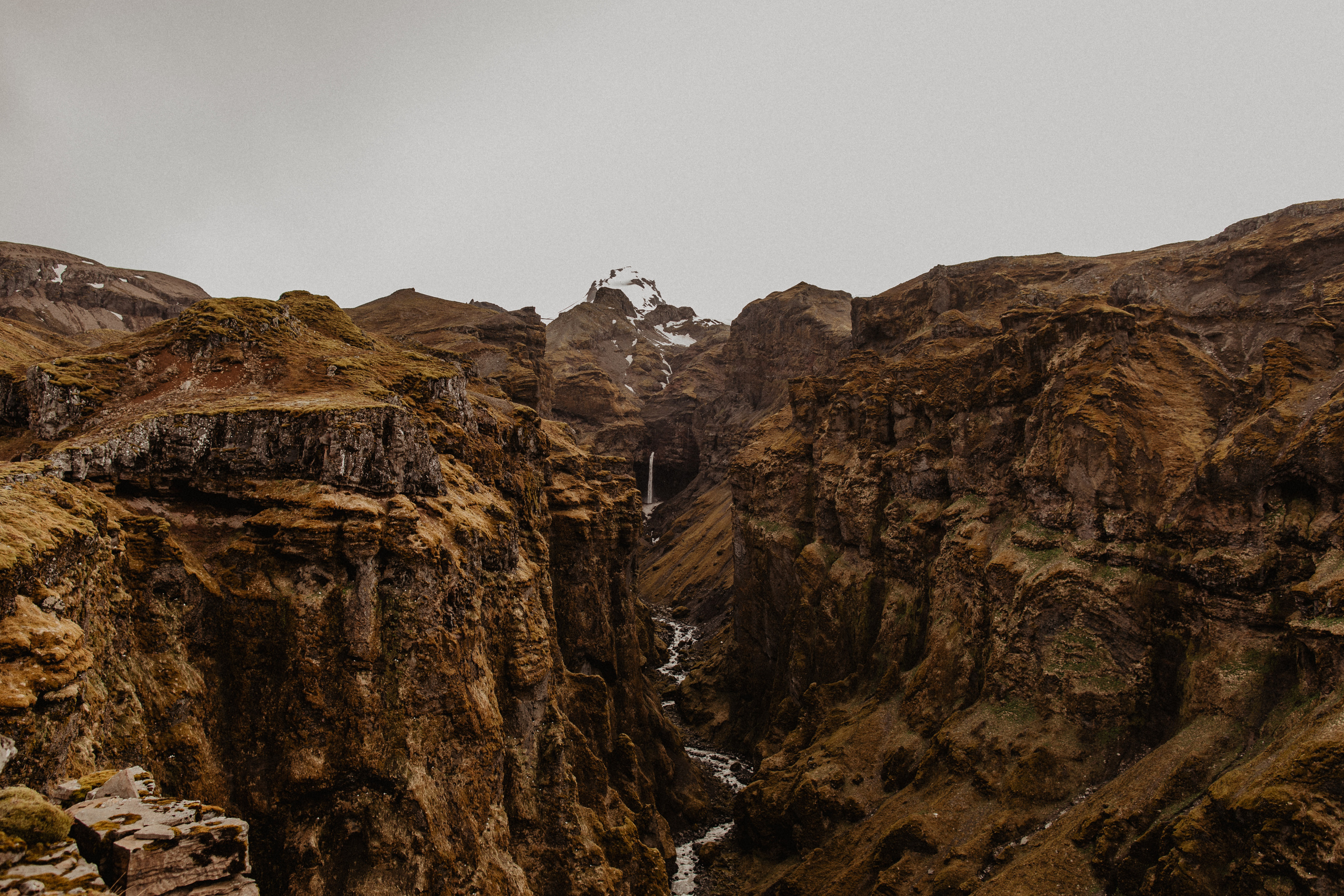 Couple photoshoot in front of volcano eruption in Iceland. Iceland elopement photographer & videographer