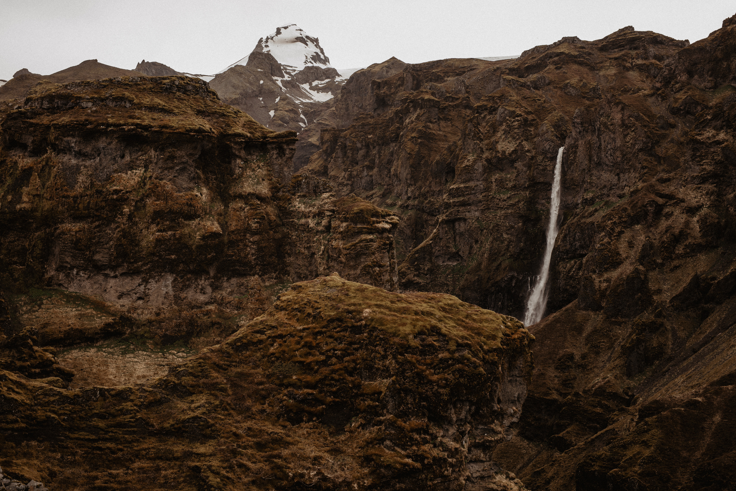 Couple photoshoot in front of volcano eruption in Iceland. Iceland elopement photographer & videographer