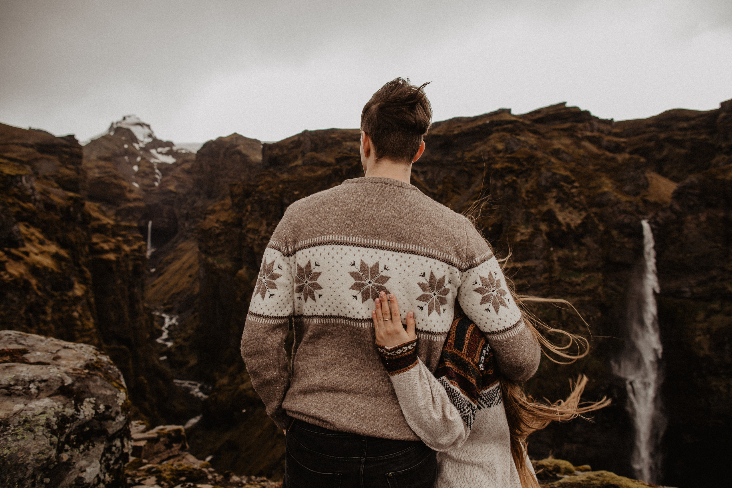 Couple photoshoot in front of volcano eruption in Iceland. Iceland elopement photographer & videographer