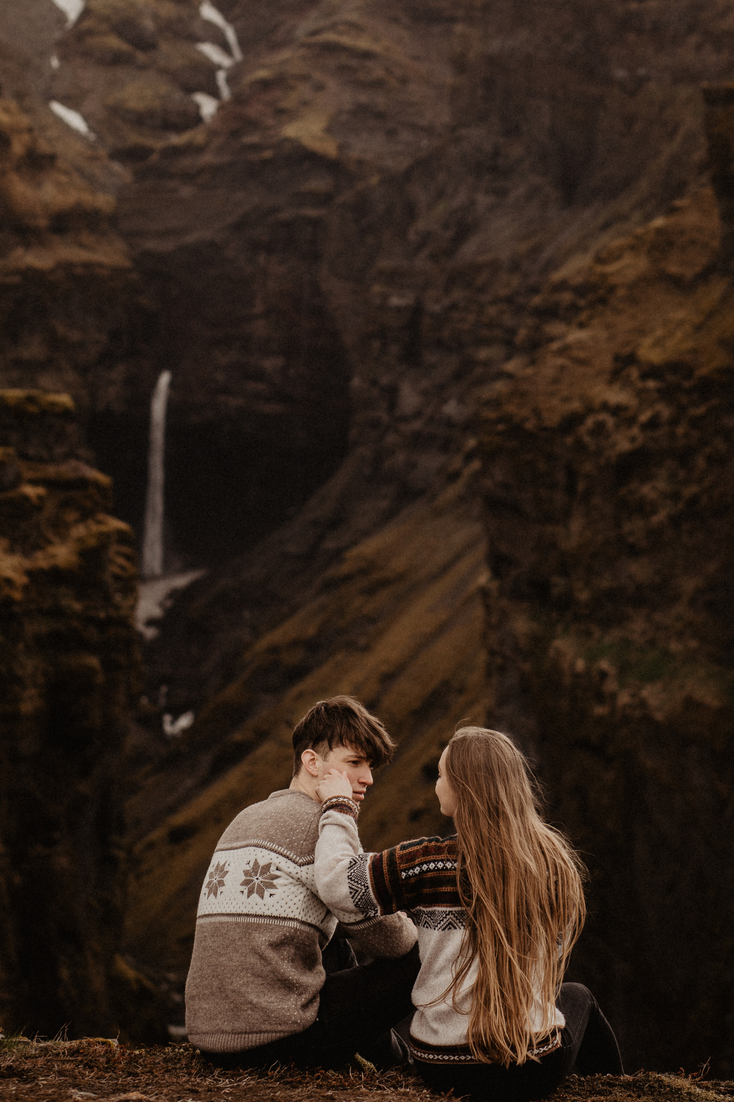 Couple photoshoot in front of volcano eruption in Iceland. Iceland elopement photographer & videographer