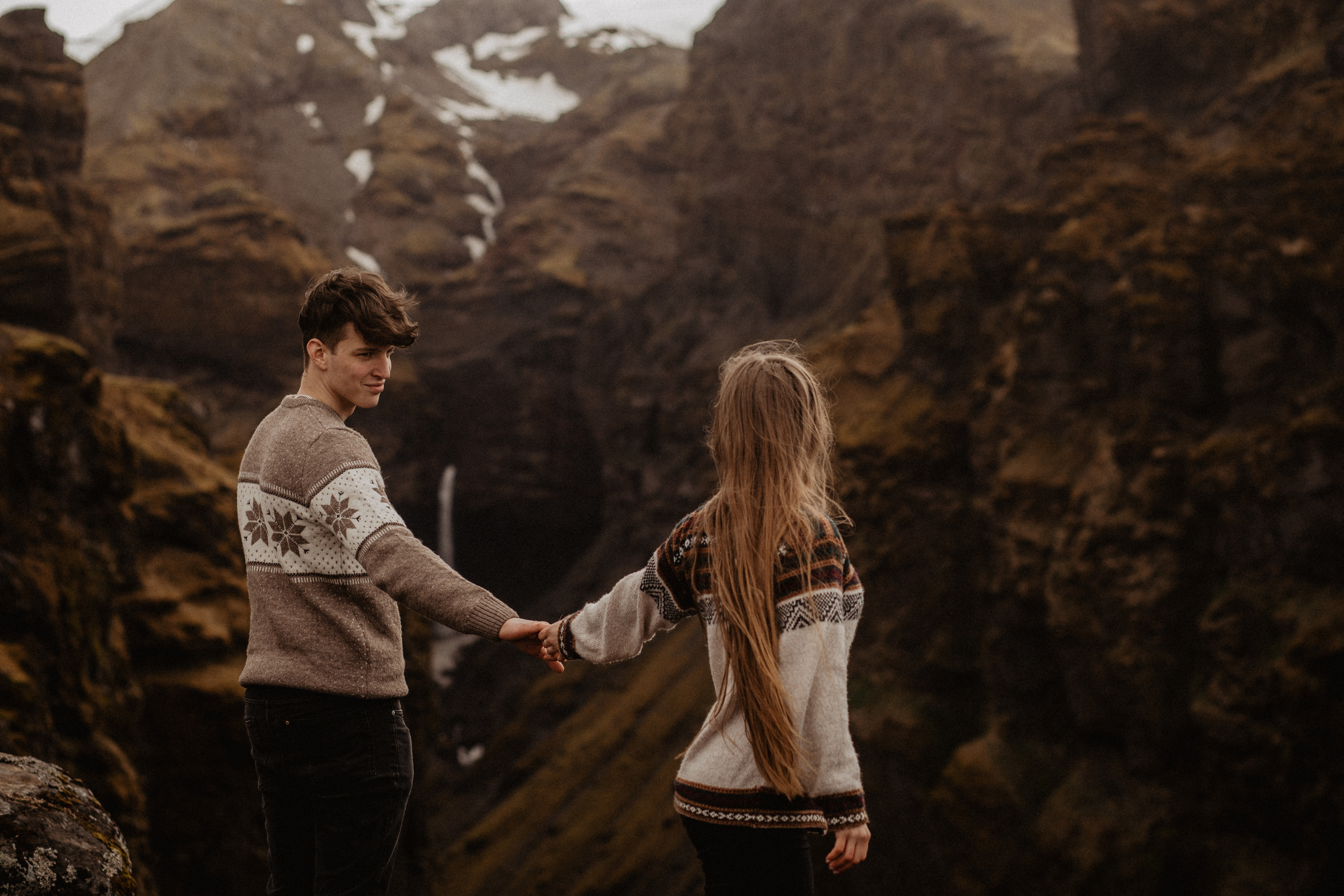 Couple photoshoot in front of volcano eruption in Iceland. Iceland elopement photographer & videographer