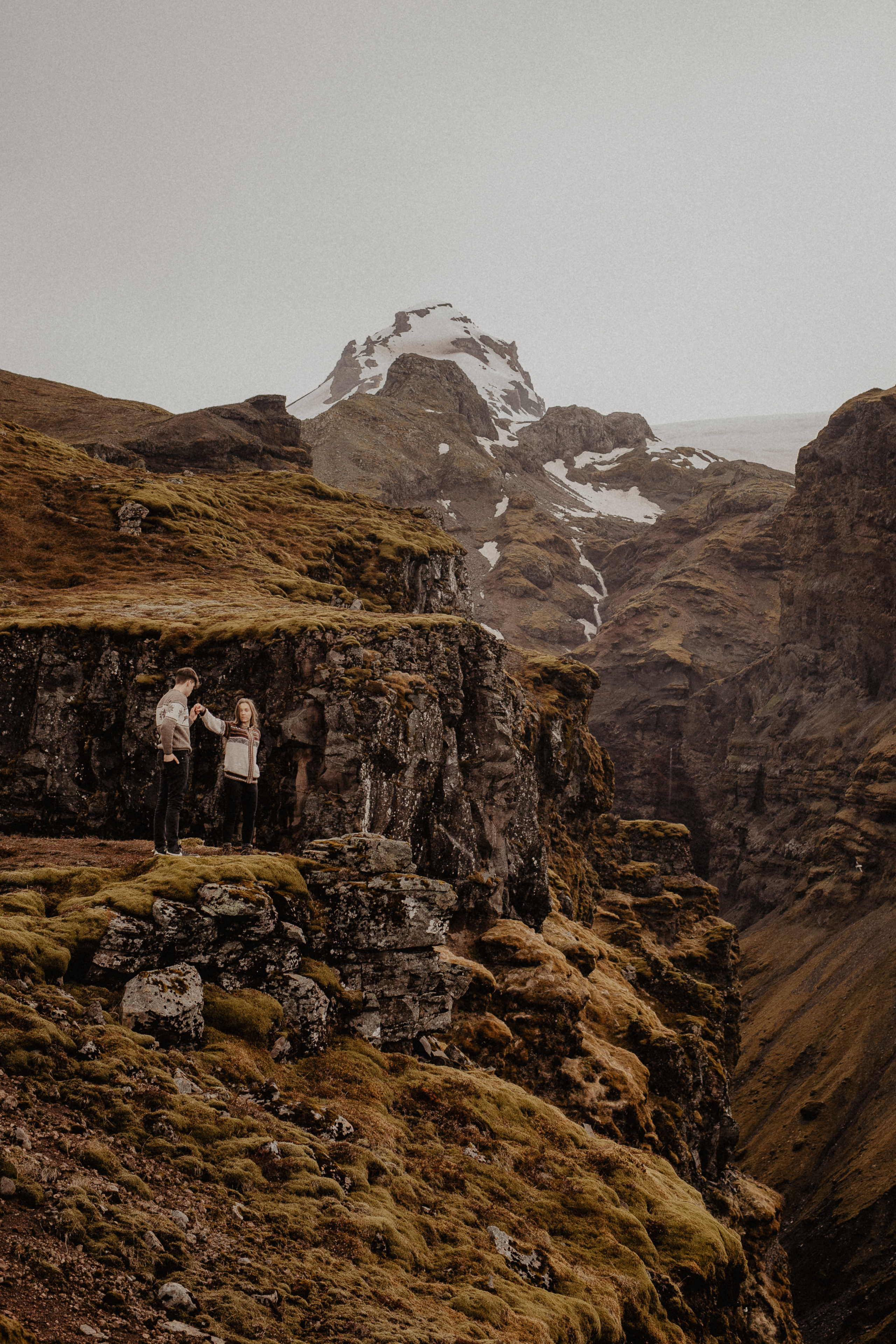 Couple photoshoot in front of volcano eruption in Iceland. Iceland elopement photographer & videographer