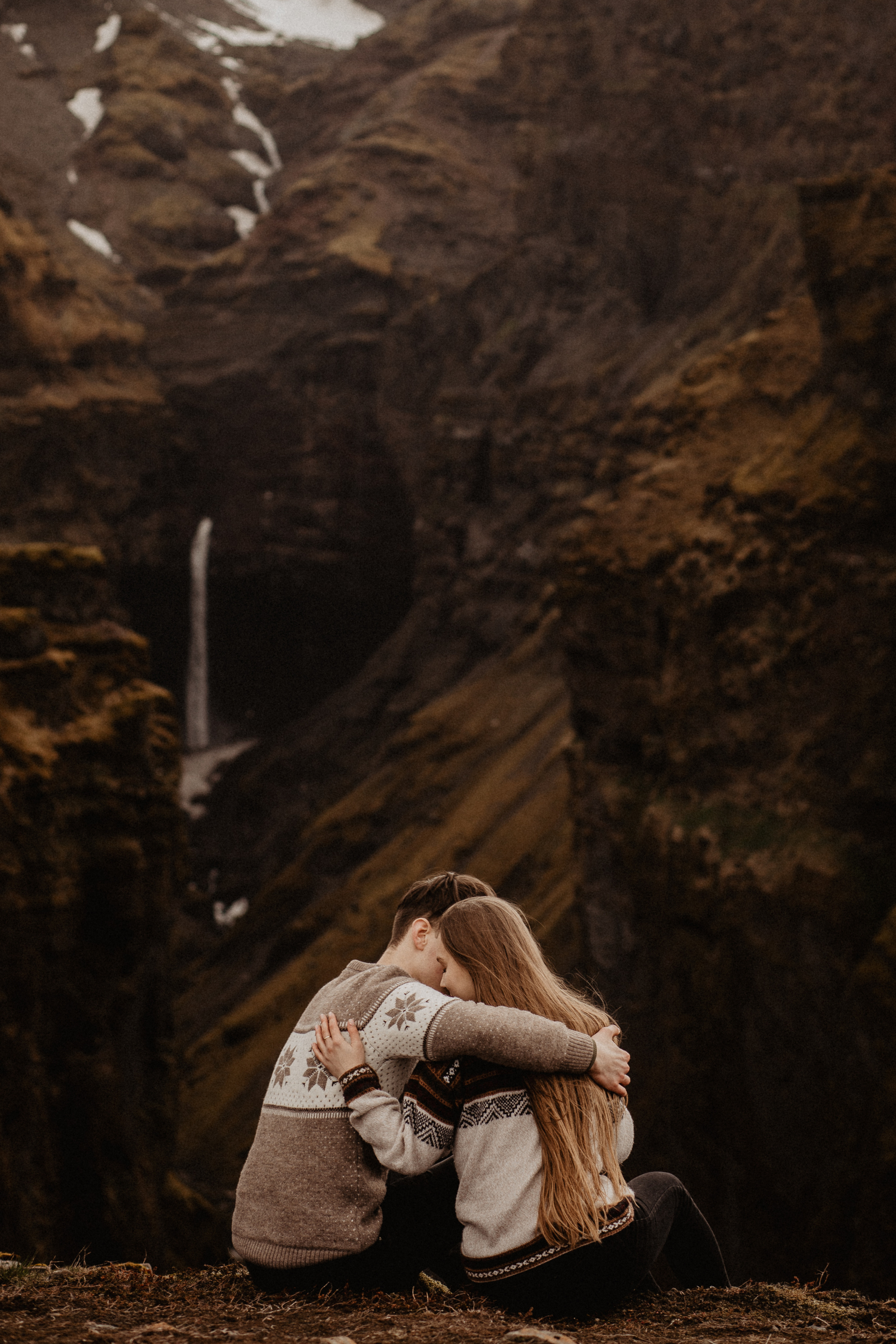 Couple photoshoot in front of volcano eruption in Iceland. Iceland elopement photographer & videographer