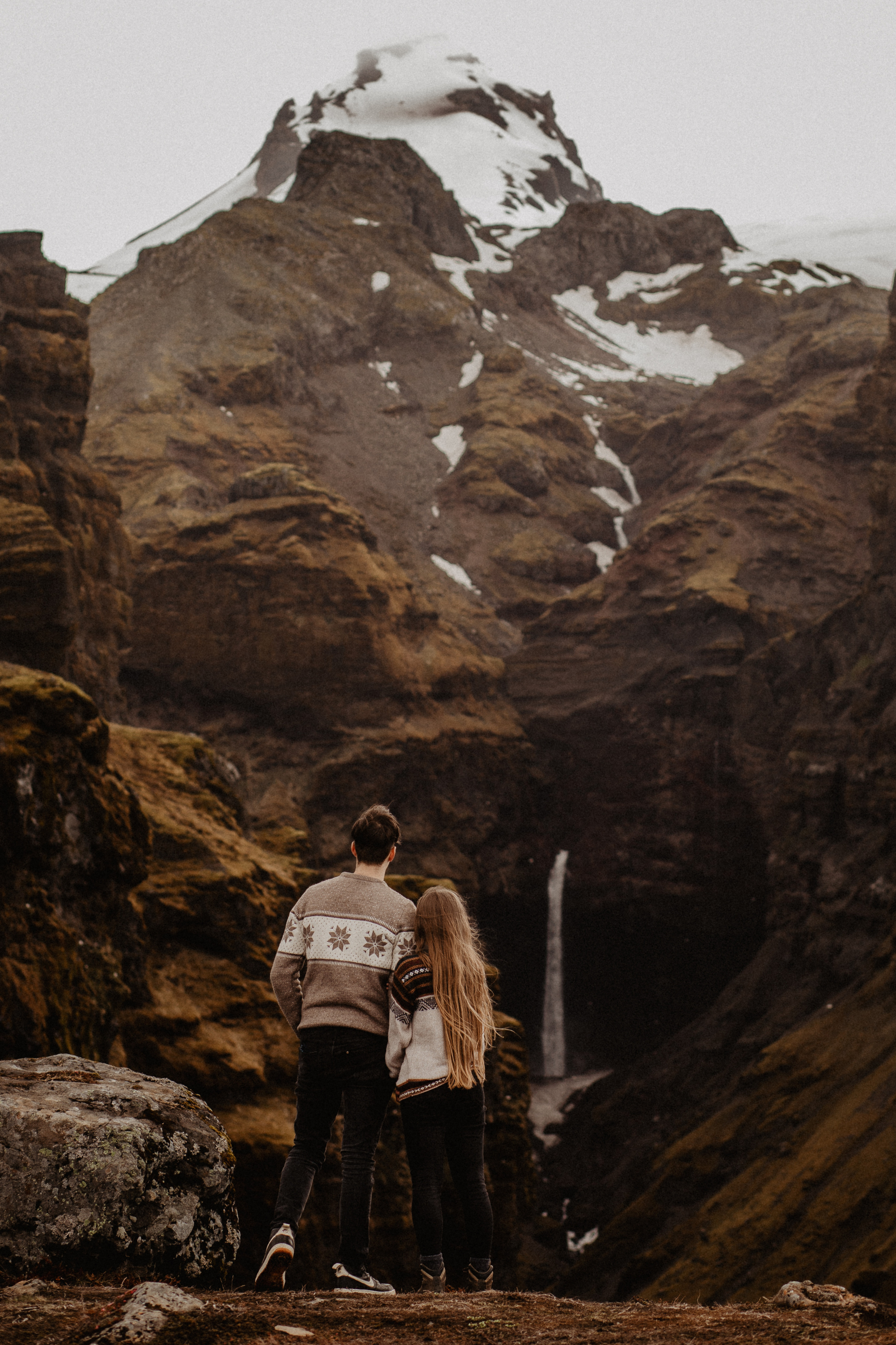 Couple photoshoot in front of volcano eruption in Iceland. Iceland elopement photographer & videographer