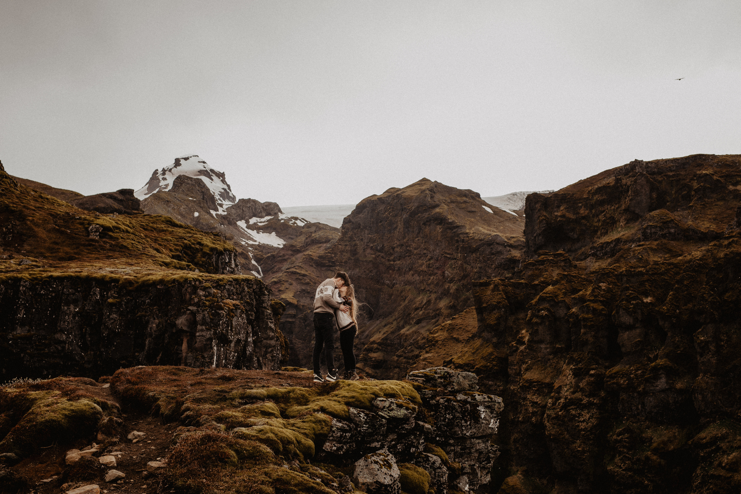 Couple photoshoot in front of volcano eruption in Iceland. Iceland elopement photographer & videographer