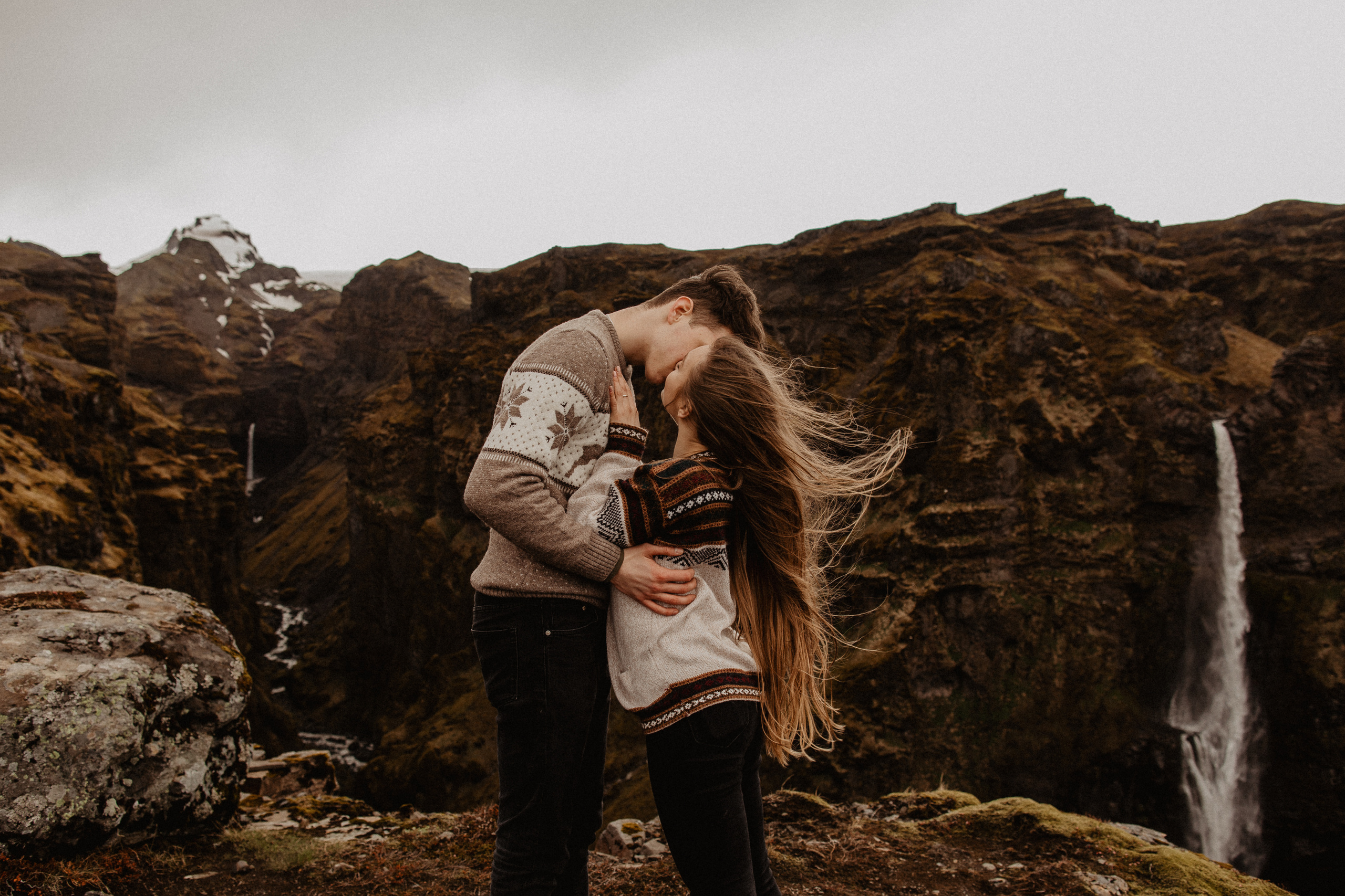 Couple photoshoot in front of volcano eruption in Iceland. Iceland elopement photographer & videographer