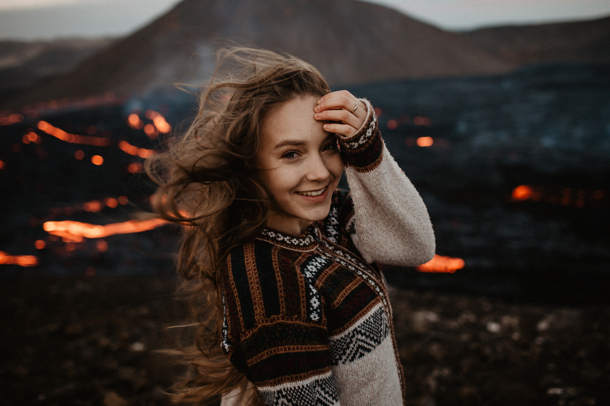Couple photoshoot in front of volcano eruption in Iceland. Iceland elopement photographer & videographer