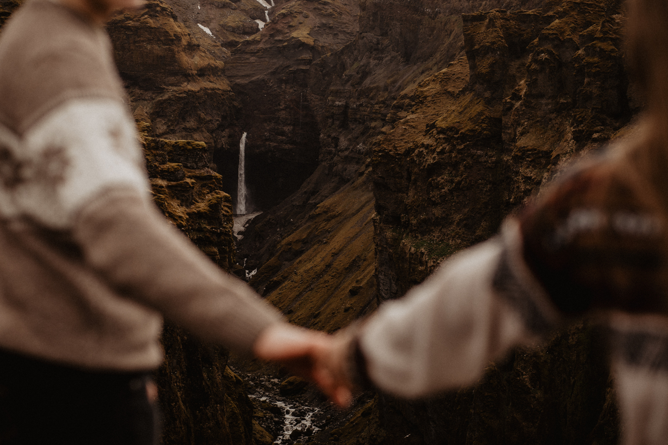 Couple photoshoot in front of volcano eruption in Iceland. Iceland elopement photographer & videographer